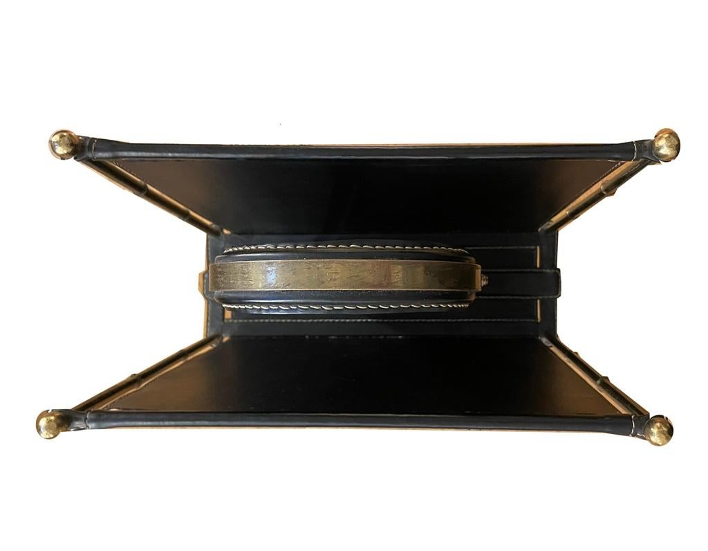 Brass Newspaper rack by Jacques Adnet for “Hermes” Paris For Sale