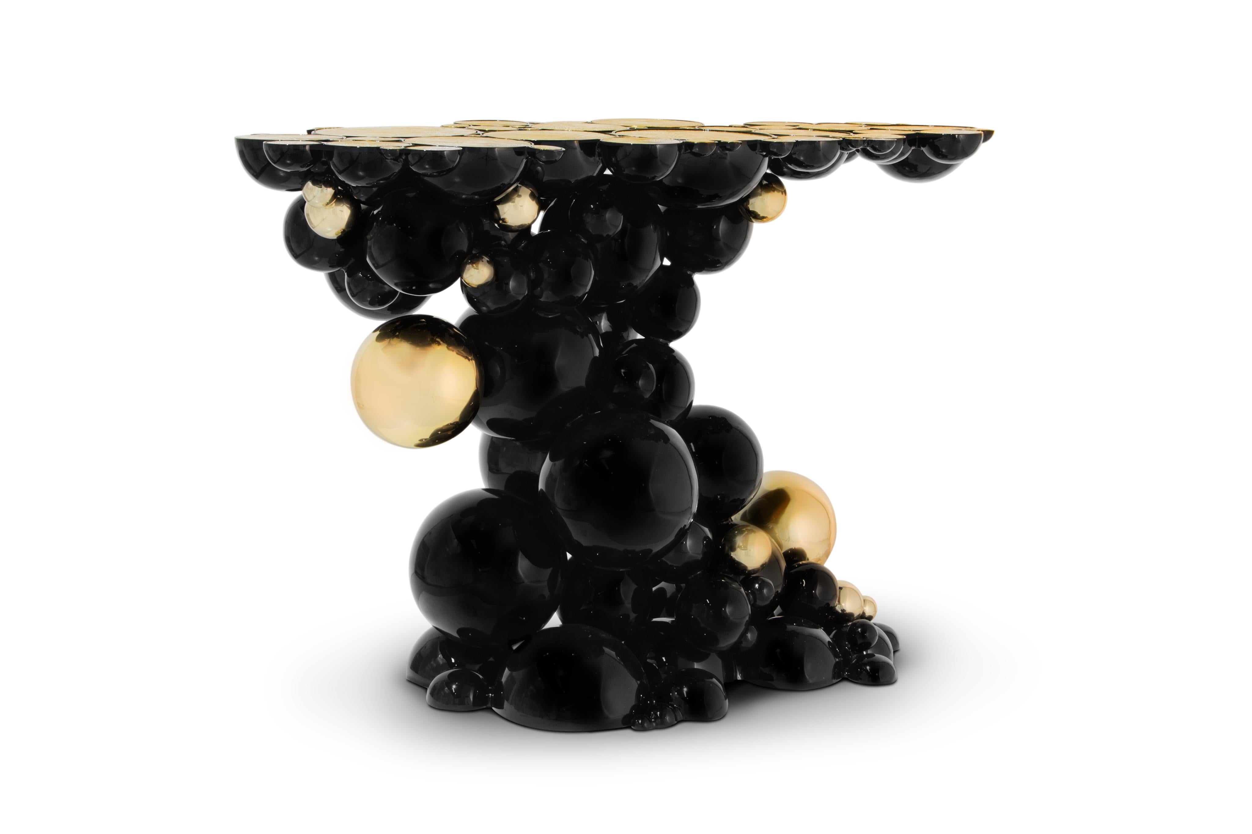 Defying the laws of physics, the Newton black and gold console has grown from the ancient art of casting metal, where metal is heated until molten into spheres and semi-spheres shape. One by one, each element is joint to produce an outstanding