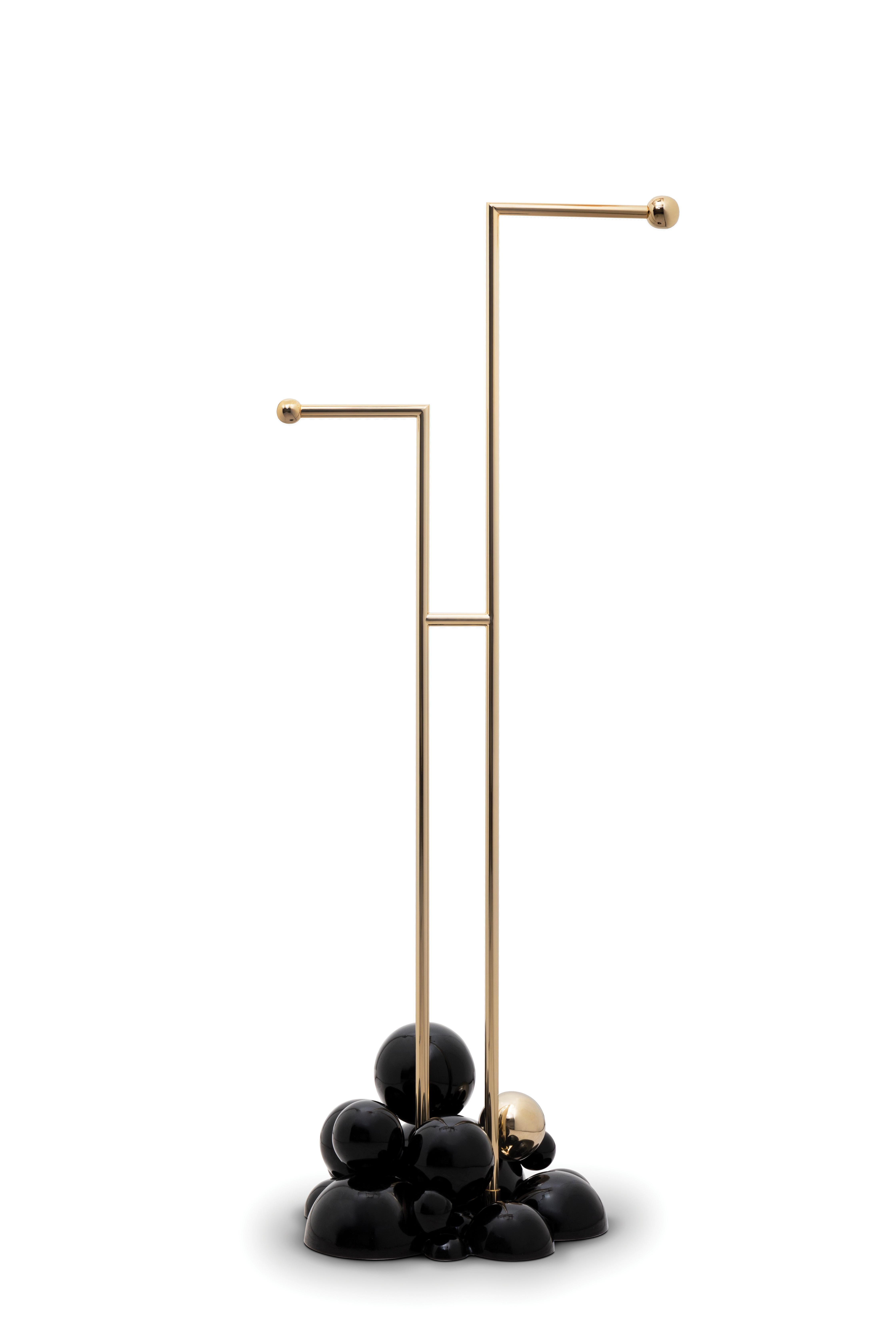 Newton is a three-tier towel rack produced in polished brass and supported by gold and black spheres. It is a revolutionary statement piece created to fulfill the needs of those who are looking for the best in contemporary furniture design mixed