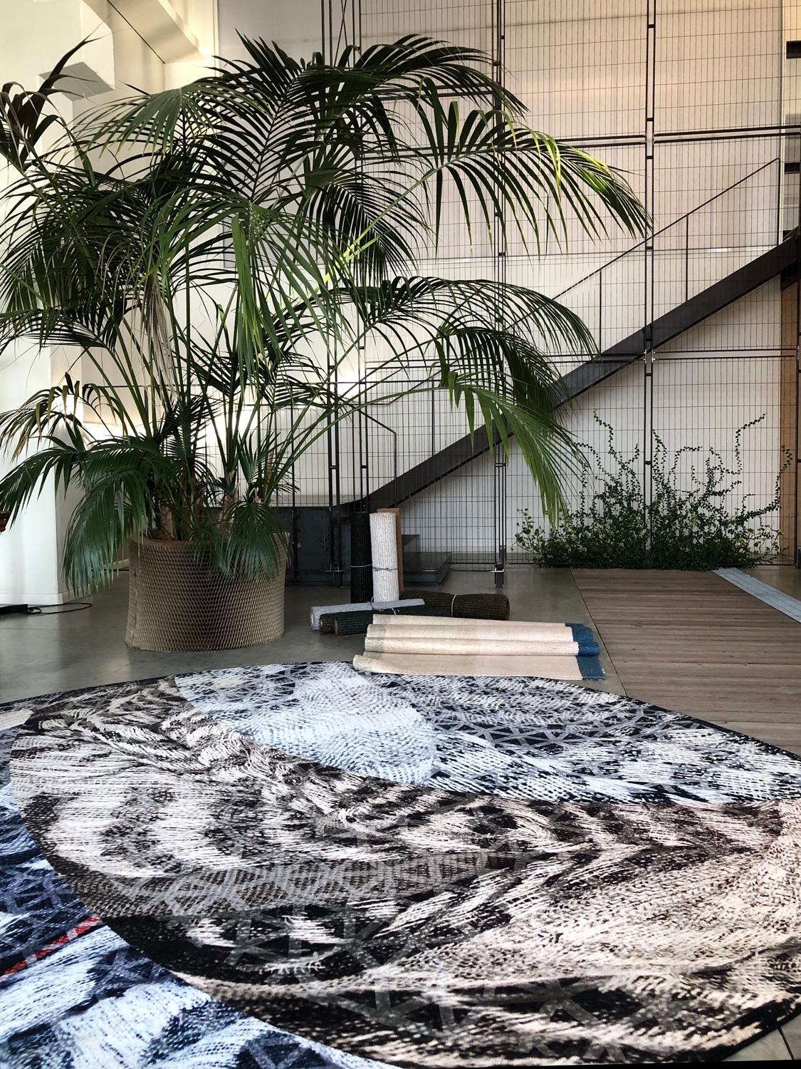 Next One of a Kind Rug by Deanna Comellini for G.T.DESIGN has an evocative design that combines the power of geometrical shapes with archaic and primordial patterns. The color palette ranges from earthy tones to deep blue and white hues, with