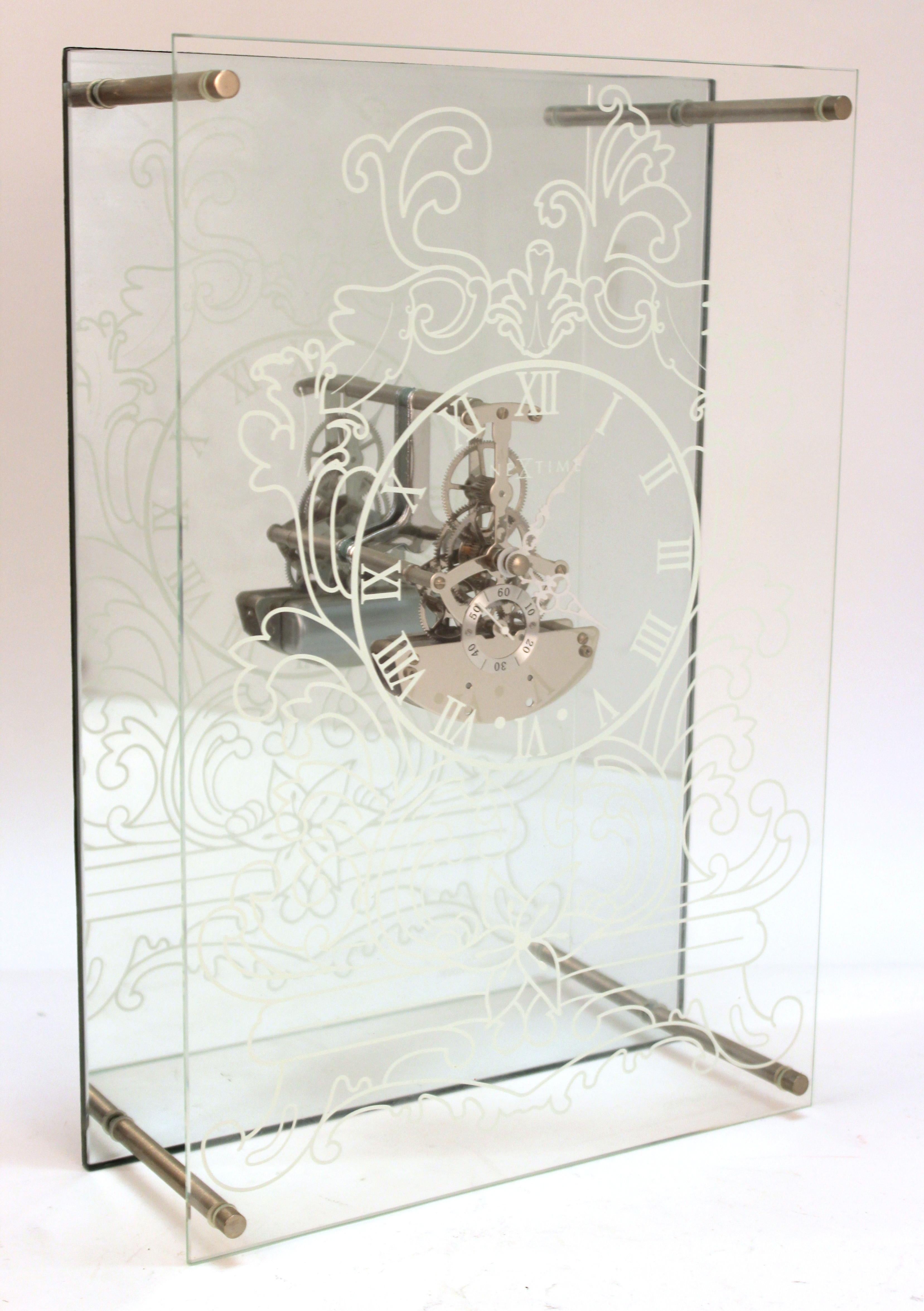 Modern 'Fantome' glass, metal and mirror clock designed by Nextime during the 2000s. The piece can be standing or hanging on a wall with a hook on the back. In great condition with very minimal wear to the glass surface.