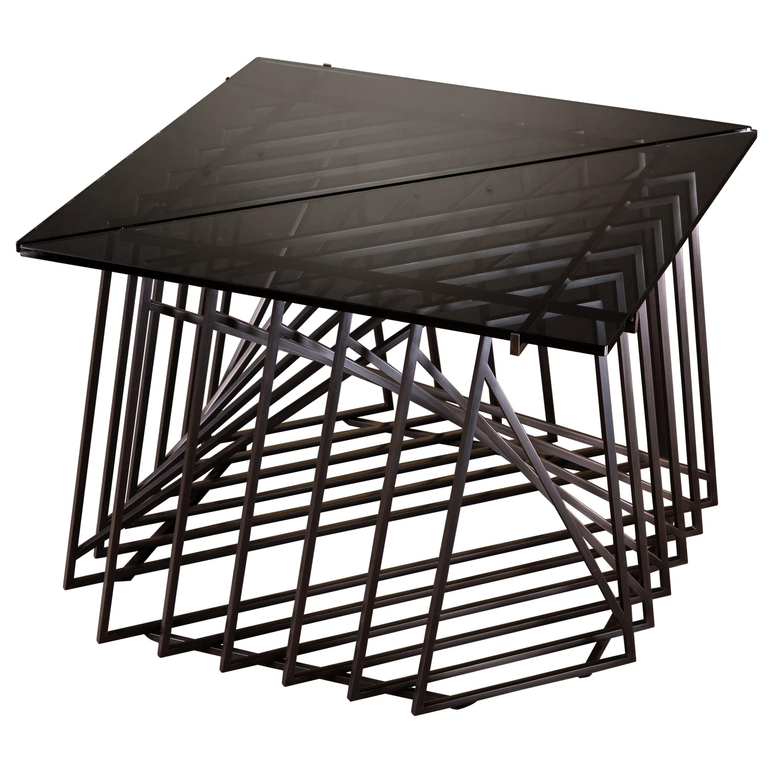 The Nexus Side Tables are a sculptural study, finely constructed and finished with satin black oxide steel and smoked gray glass. Versatile and modular, the triangular tables can be fully customized to be used independently, as a square duo, an