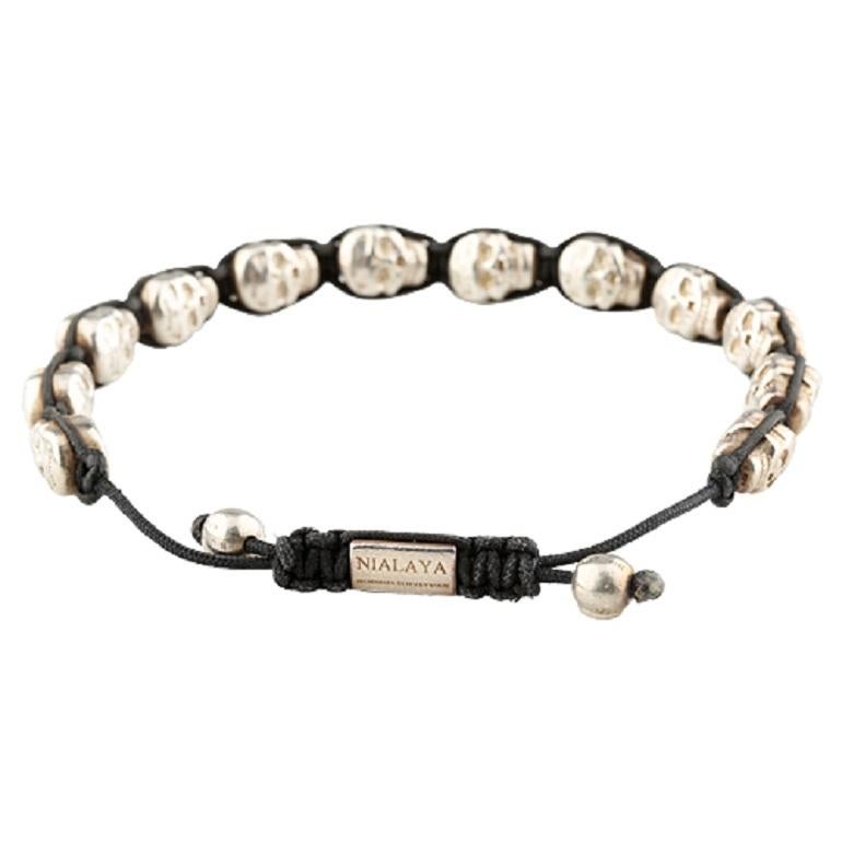 Men's Skullbead Shamballa silver bracelet
Designed by Nialaya of Hollywood
Constructed of 925 sterling silver
Includes signature lock, two 7mm skull balls, twelve 10mm double sided skulls
Hallmarks: (Lock) 