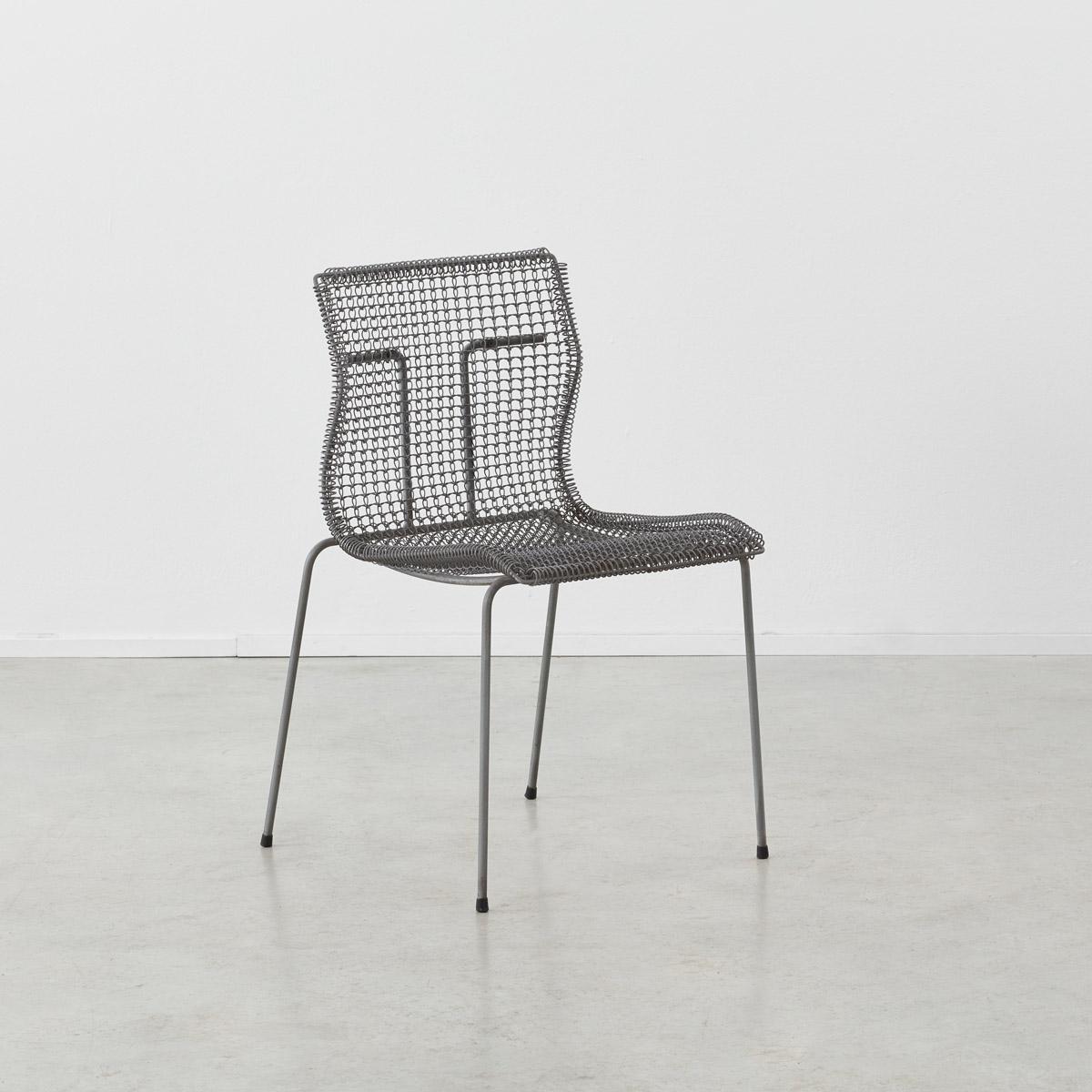 The Rascal chair was designed by Niall O’Flynn (1959-present) for Dutch manufacturer ‘t Spectrum Bergeijk. It is comprised of a tubular galvanized metal frame and a woven metal seat. An intelligent use of minimalistic and industrial materials, the