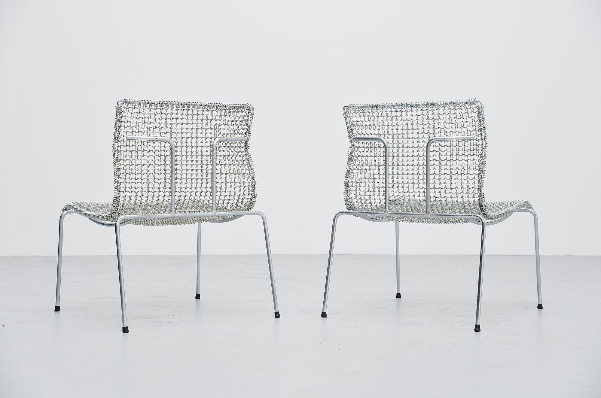 Nice pair of timeless easy chairs designed by Niall O’Flynn for ‘t Spectrum in 1997. These chairs were in production for only 4 years. Fantastic shaped chairs, made of galvanized metal. The chairs do not look really comfortable but they surprisingly