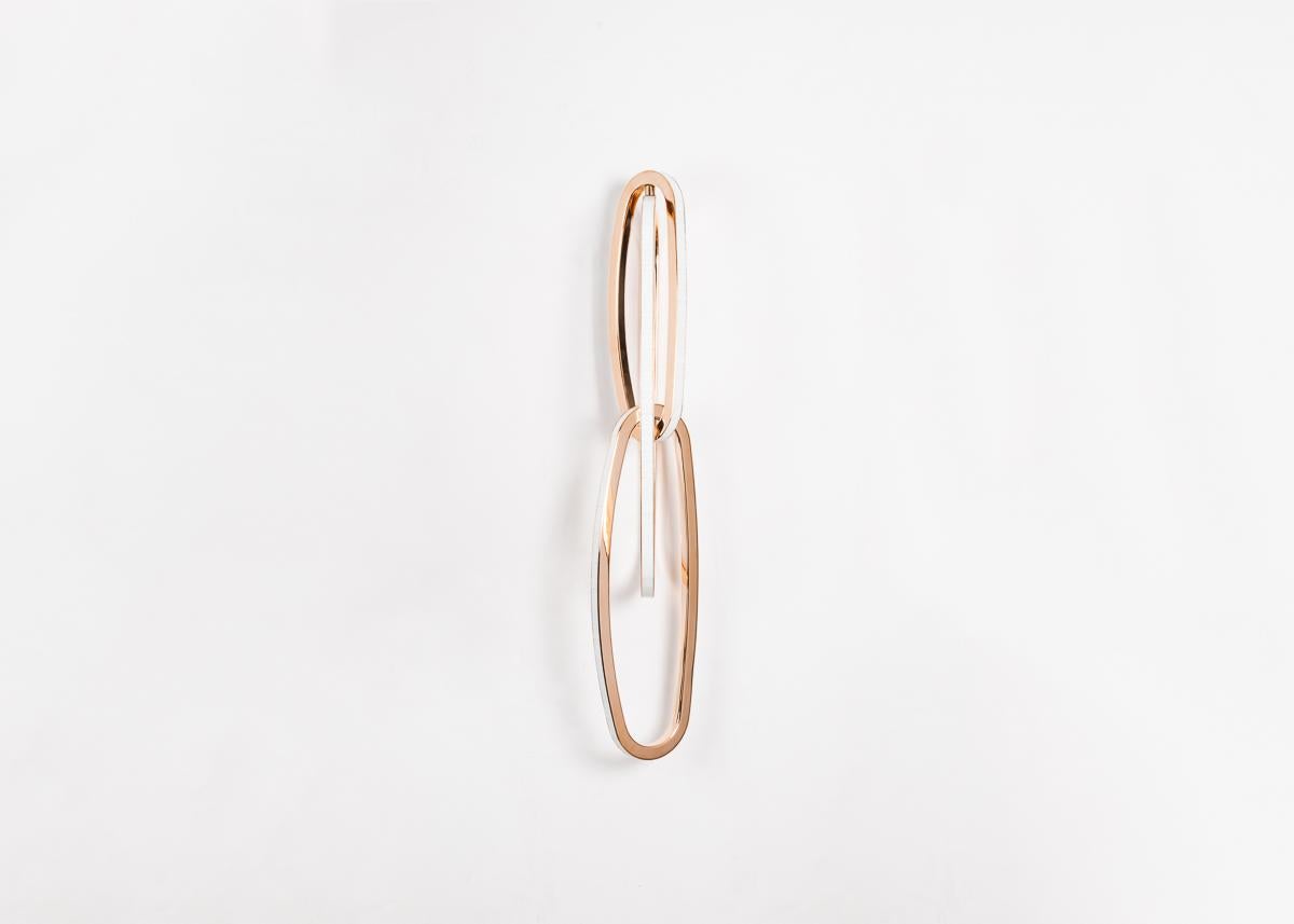 Fouette, a sconce in bronze, glass, and LED, is arranged in Barry’s signature composition of interconnected ellipses—in this case, uniform in shape, and suggestive, together, of the ballet position from which they take their name. 

Size and finish