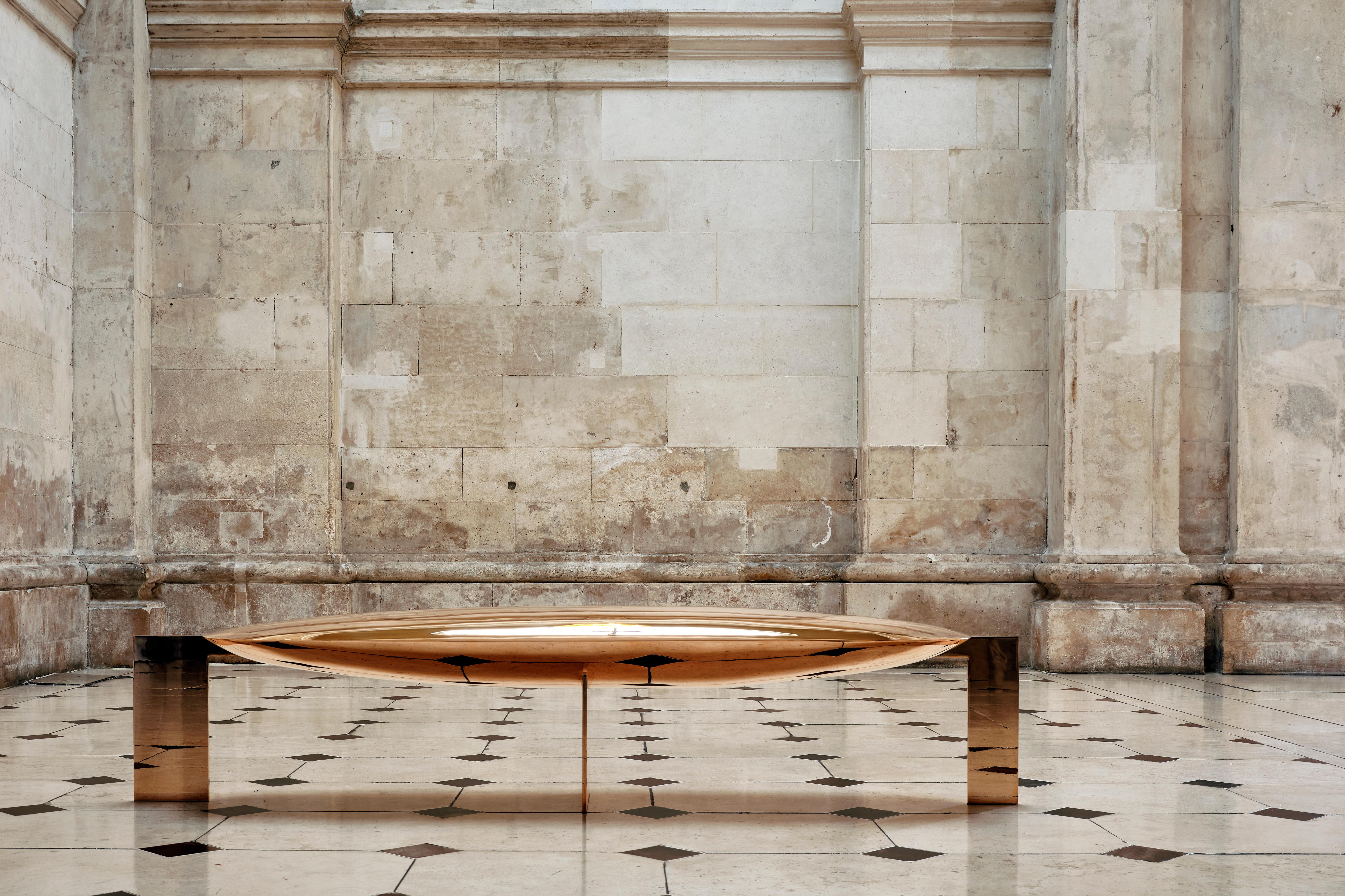 This gently swelling bench, completely finished in polished bronze (and the product of hundreds of hours of work), is totally reflective and appears to float on its three rectilinear supports. Niamh Barry often says that her sculptures are drawings