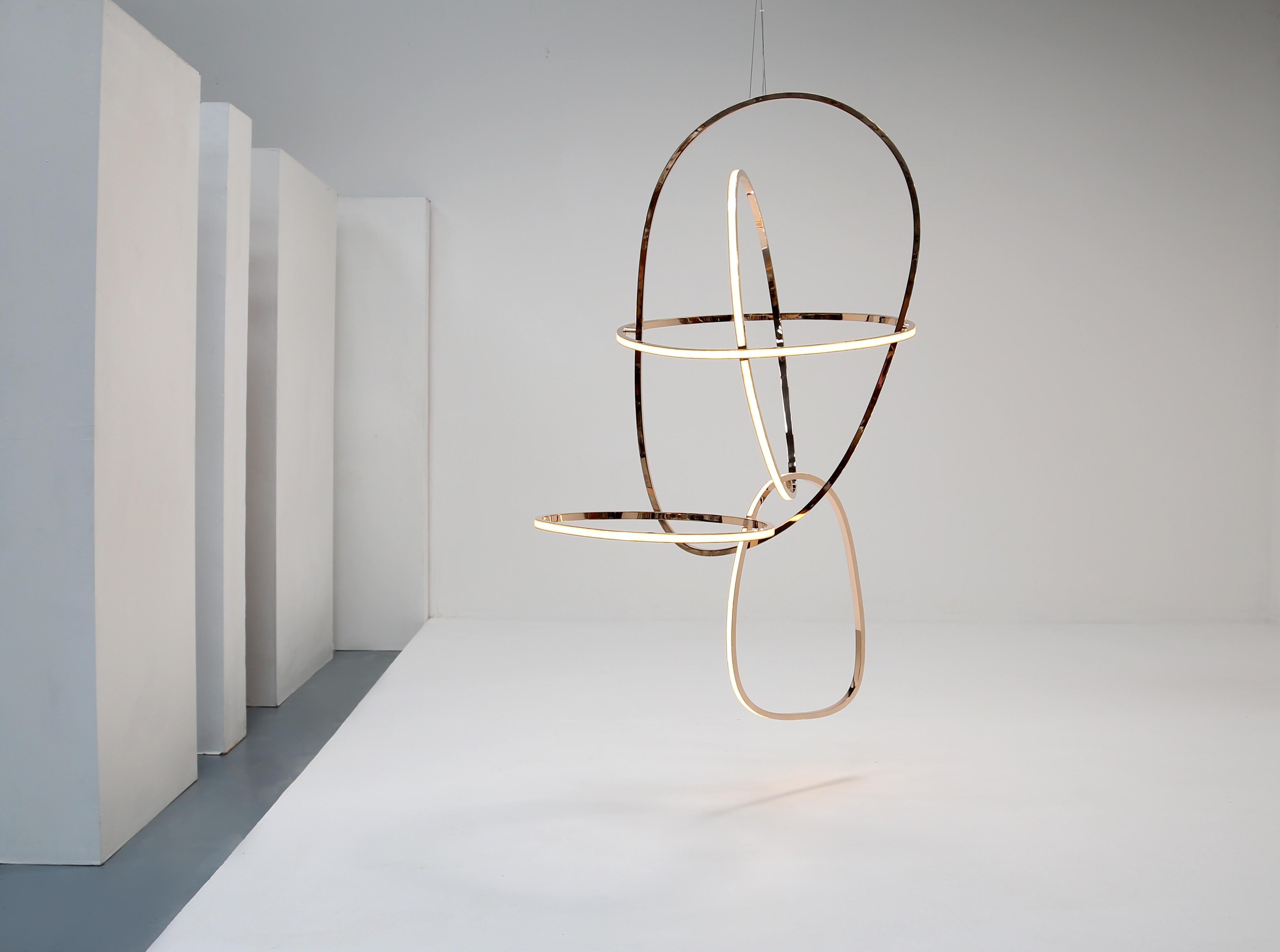 This remarkable sculpture by Niamh Barry—a composition of fluid rings in polished bronze and LEDs covered by tiled strips of opal glass—is, like much of the artist’s work, inspired by the human form and its movements. Titled Head II, in particular,