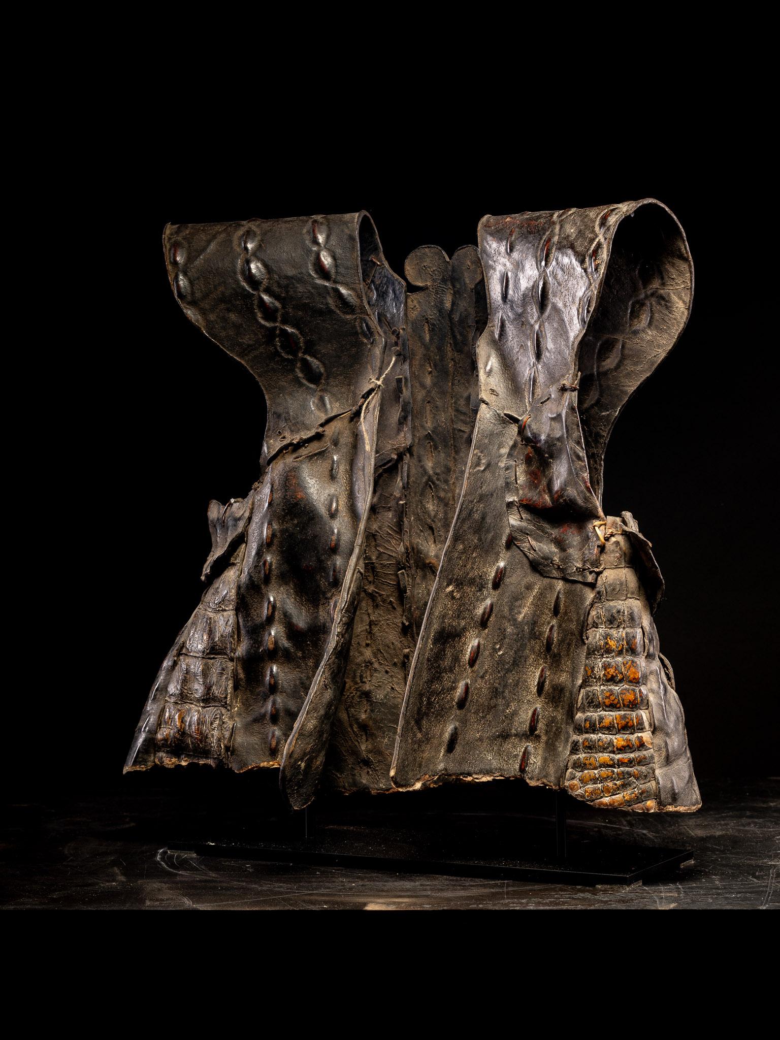 The Oroba is a traditional vest-shaped armor native to Nias Island, known for its historical craftsmanship and protective qualities. The oldest versions, known as öroba uli mbuaya, are crafted from crocodile skin. These are composed of 11 pieces of