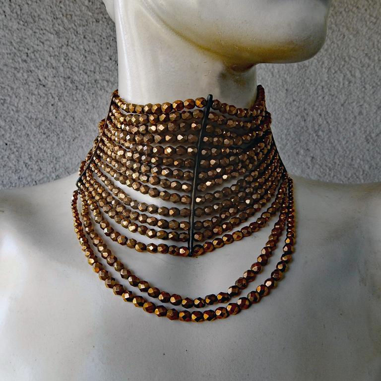 Authentic Christian Dior by John Galliano runway Masai Necklace, in a rich bronze color.  

Perfect Valentine´s Day gift.  Similiar in style to the huge necklace worn by Charlize Theron for J'adore Dior advertising.

Necklace is in mint condition
