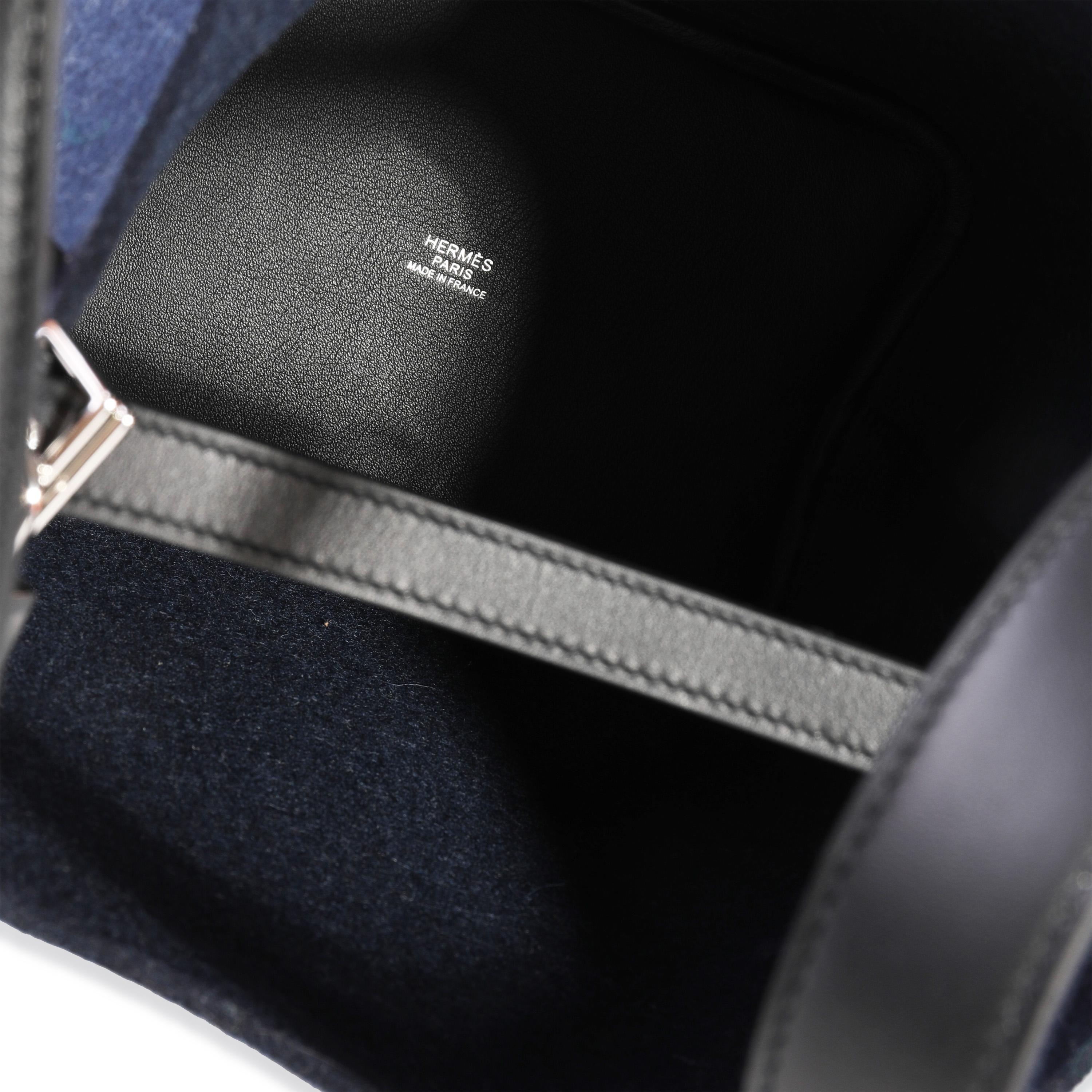 Listing Title: NIB Hermès Bleu Nuit Feutre & Black Swift Picotin Lock 18 PHW
SKU: 118287

Handbag Condition: Mint
Condition Comments: Mint Condition. Plastic on feet. No visible signs of wear. Final sale.
Brand: Hermès
Model: Picotin Lock
Origin