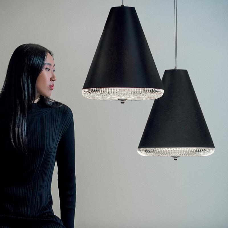 A single drop breaks the calm surface of the water,
releasing concentric circles that ripple outwards and penetrate its cool depths.
Luminous crystal casts an aura of light.

Nibel is a minimalistic pendant light consisting of handmade, diamond-cut