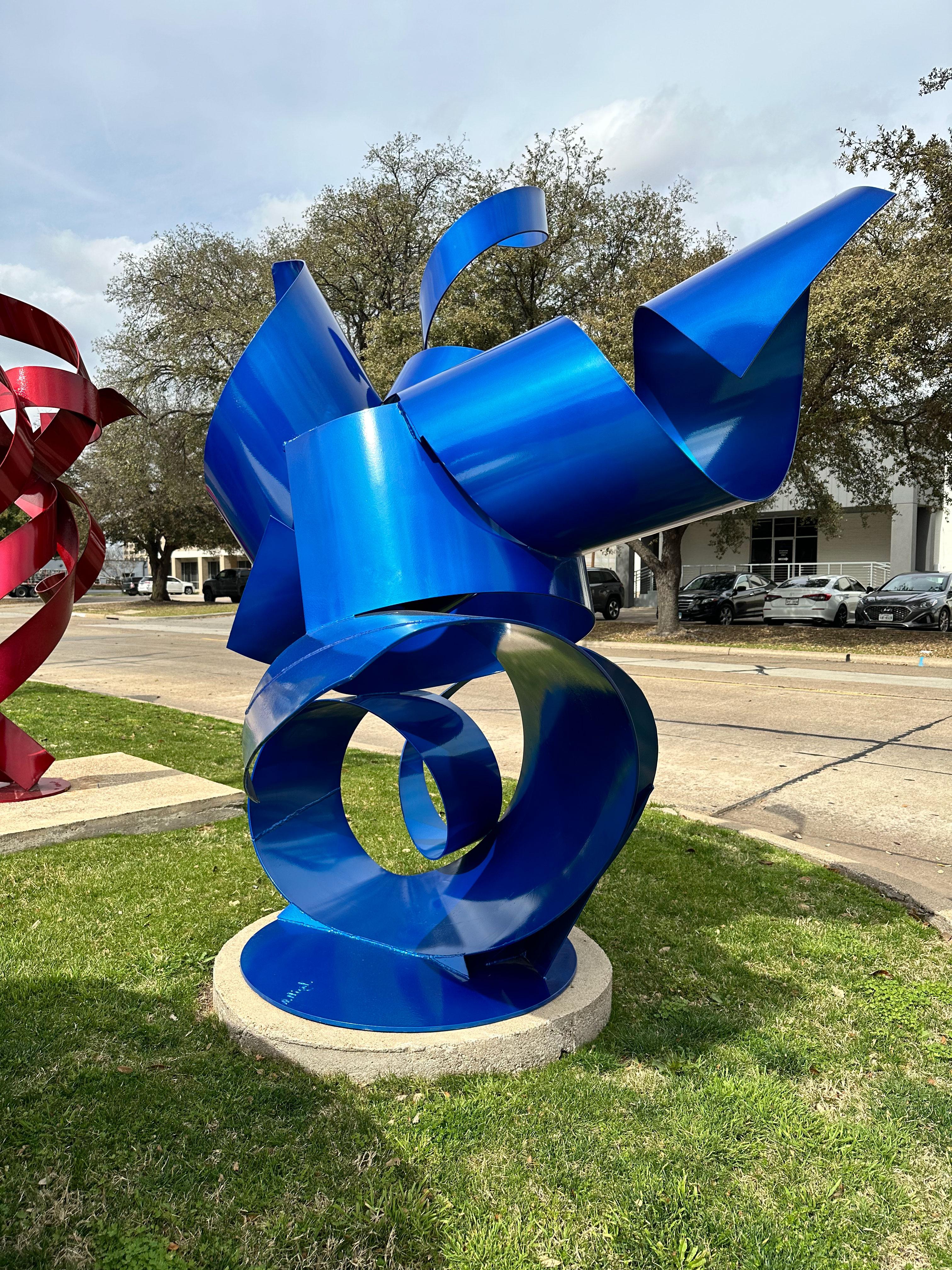 Nic Noblique is a Texas-based sculptor whose preferred medium is steel. Noblique has, in a relatively short amount of time, become one of the foremost abstract sculptors in the United States. This piece, entitled "Look Inside My Twisted Blue Mind",