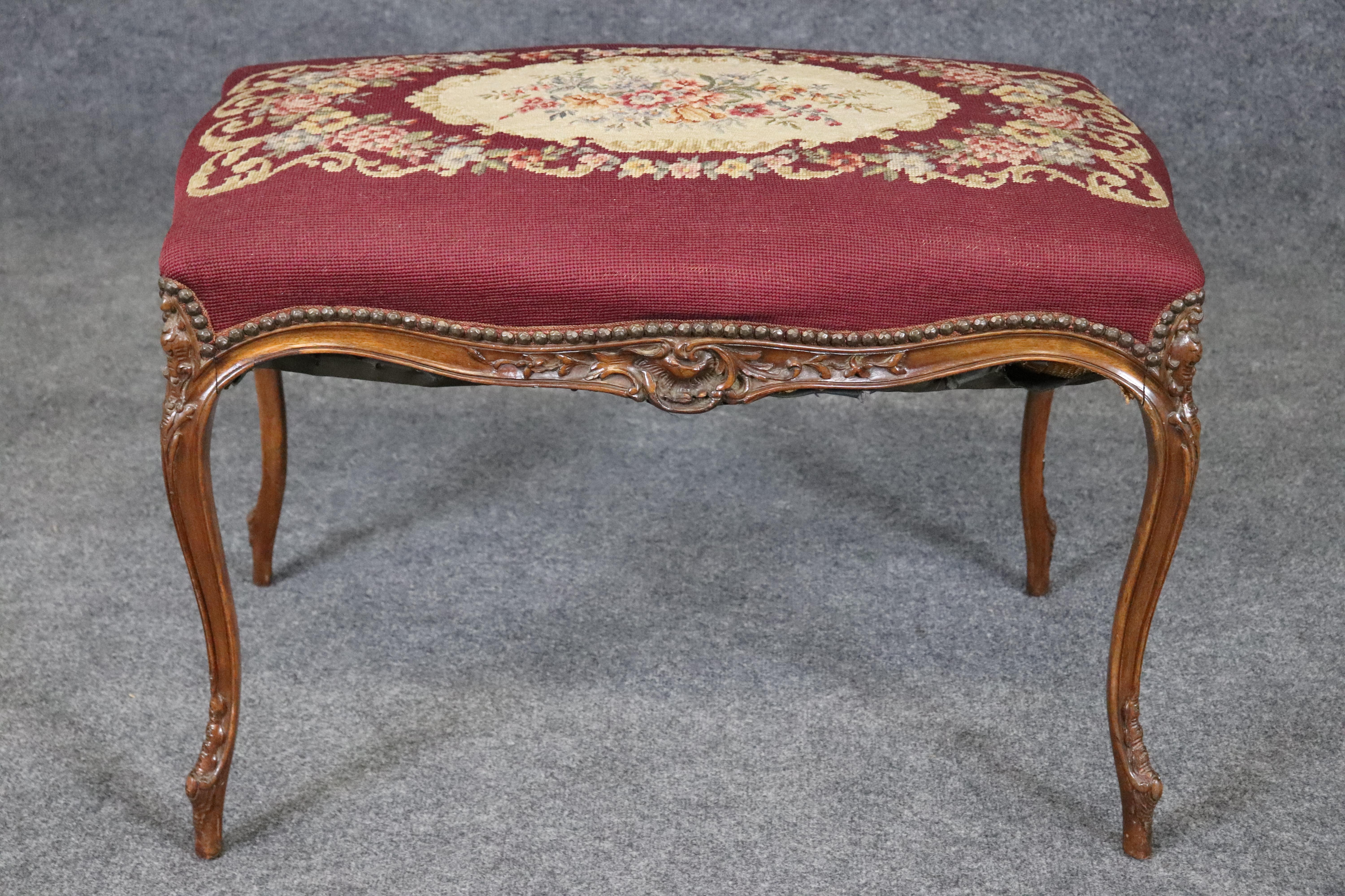 This is a gorgeous 1870-80s era French-made Louis XV style walnut stool. The stool has beautiful petite point and needlepoint on top in good condition and minor fabric coming a little loose on the base. We will be happy to repair this at full sales