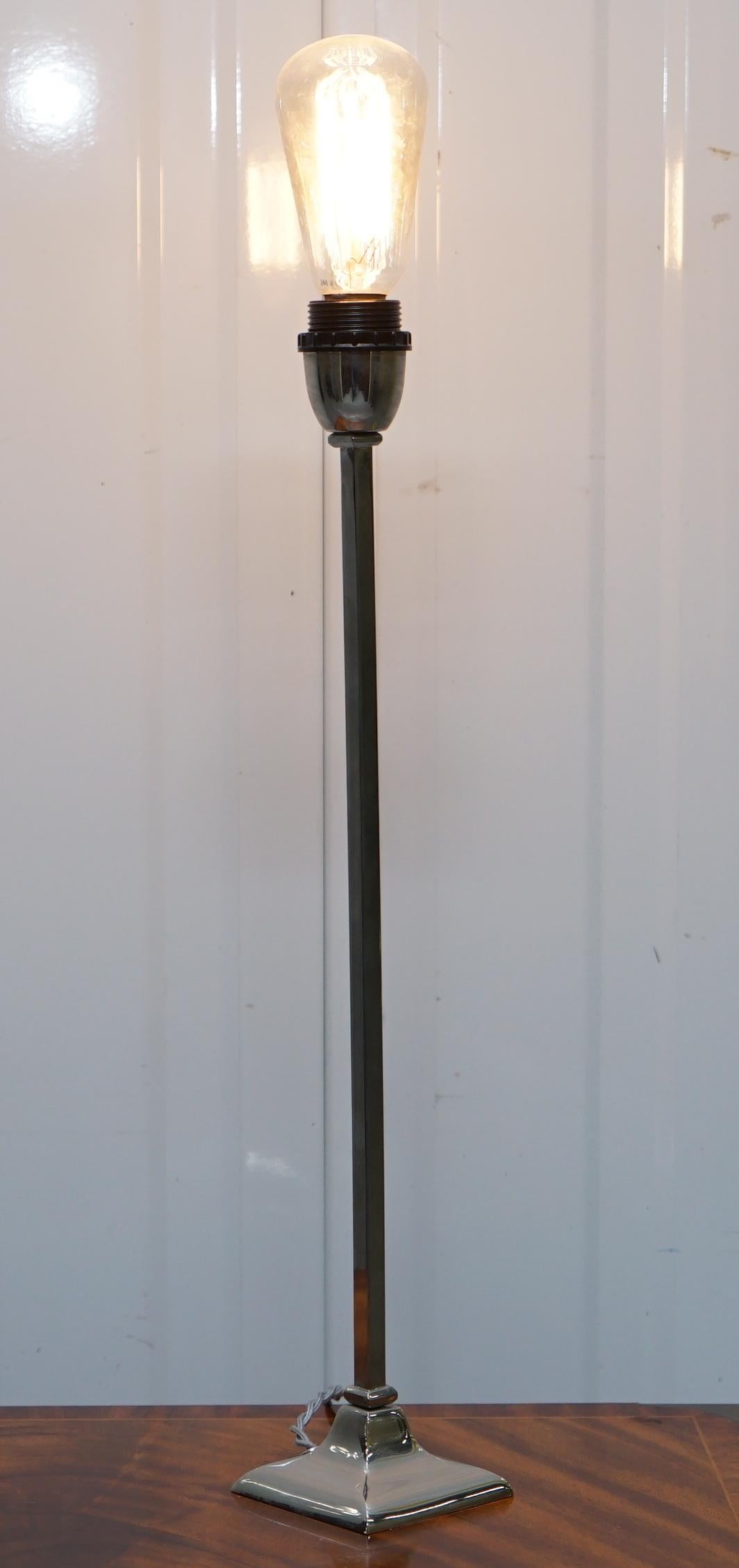 We are delighted to offer for sale this stunning solid polished metal to a chrome finish tall elegant table lamp

As you can see from the base this is a fully cast solid metal polished lamp, its not coated but the raw metal, a very cool thing