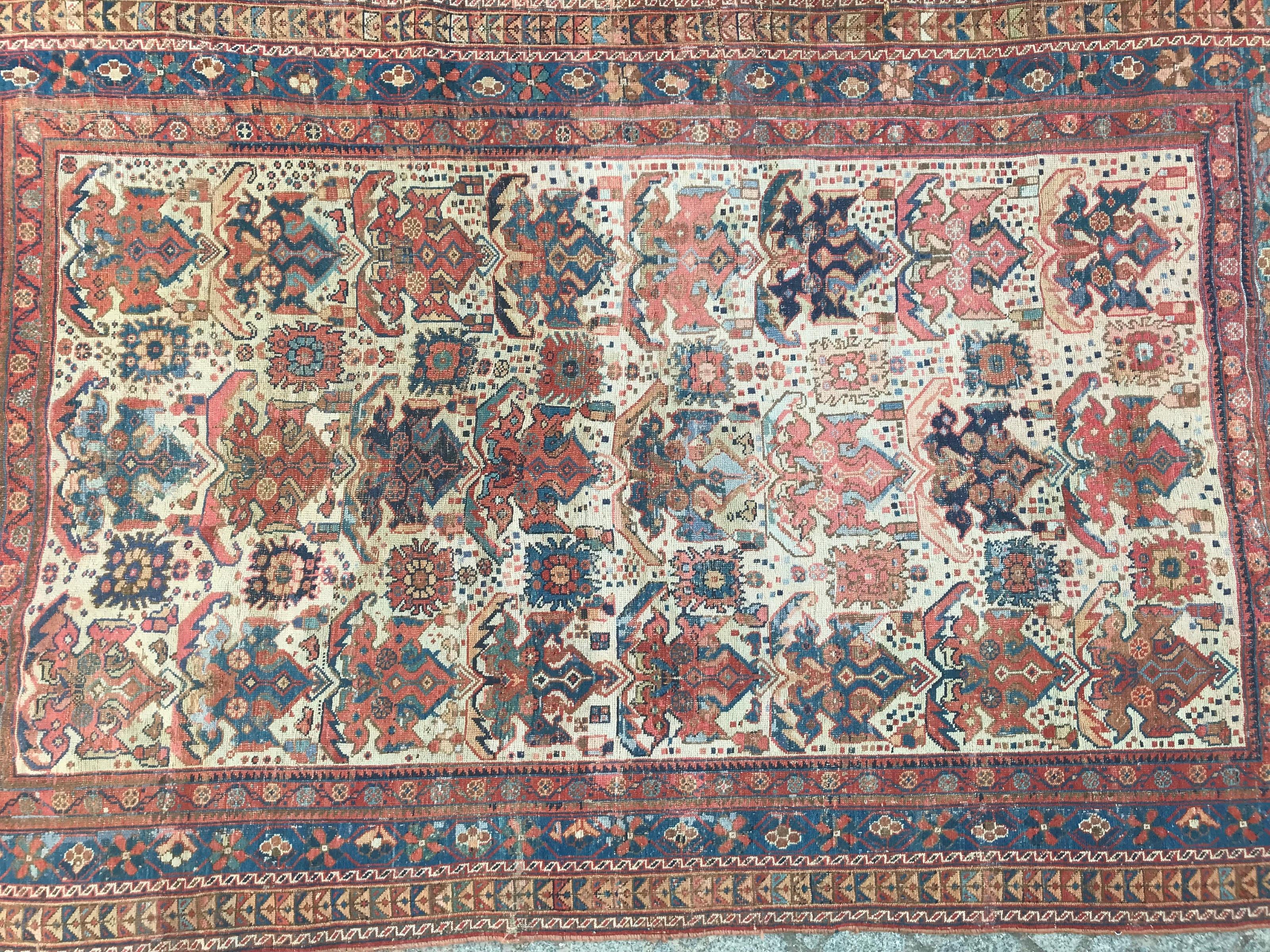 Very decorative 19th century rug with beautiful tribal design and natural colors with red, orange, blue and yellow, entirely hand knotted with wool velvet on wool foundation. Measures: 4ft 1in x 7ft 7in.