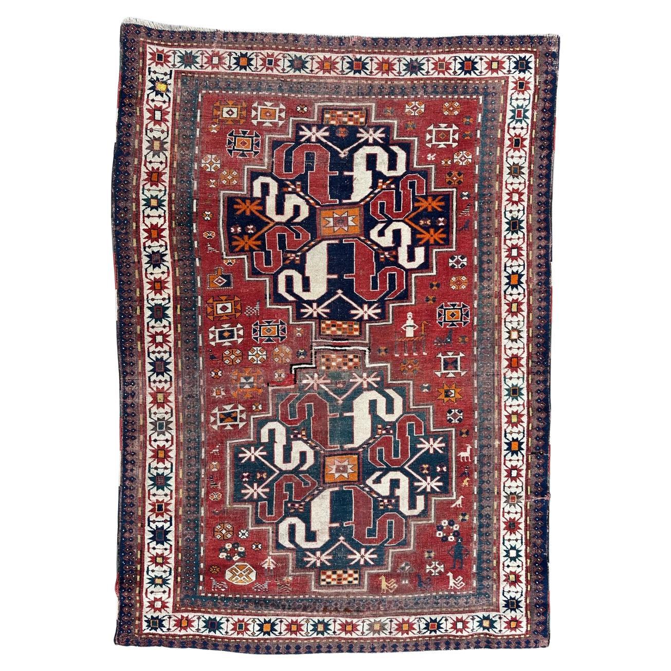 Nice antique distressed Kazak Chelaband rug