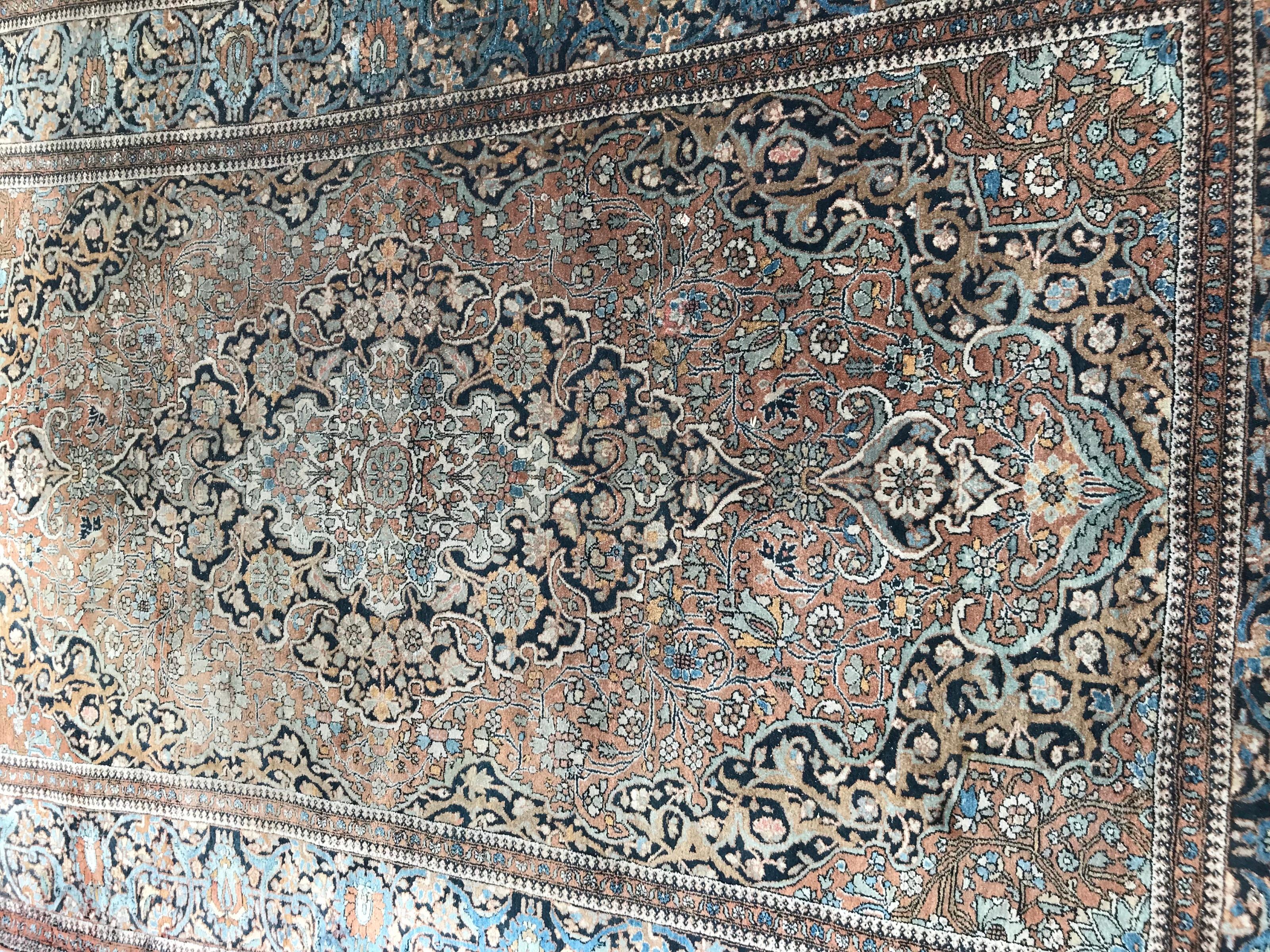 Very beautiful and fine late 19th century rug with beautiful floral design with a central medallion and nice natural colors with orange, blue, green, yellow, brown and black, entirely and very finely hand knotted with wool velvet on cotton