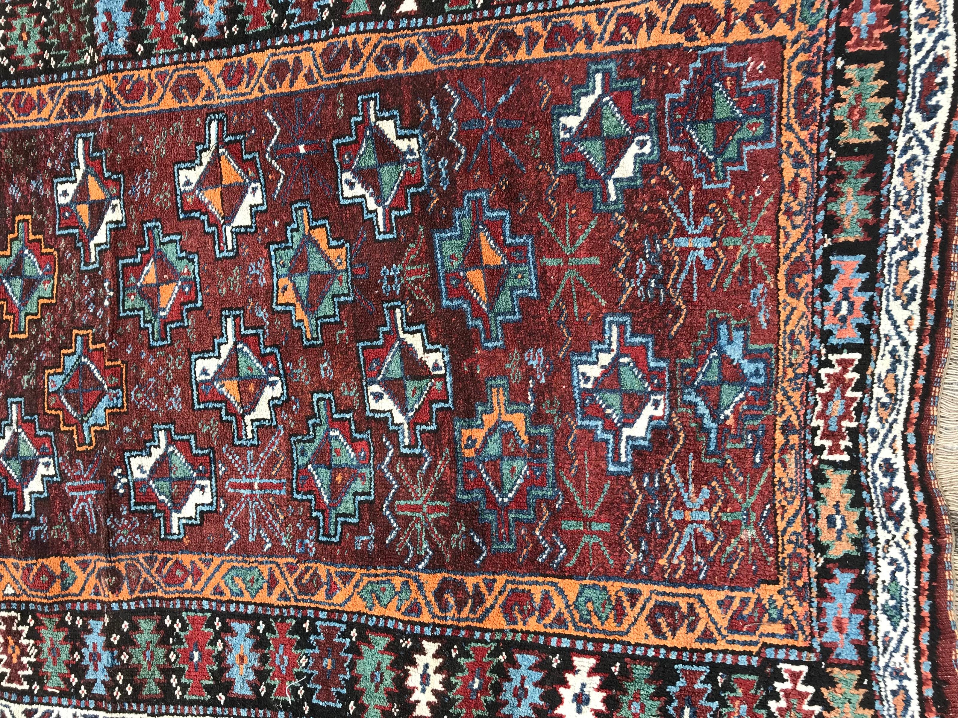 Beautiful early 20th century Kurdish rug with nice geometrical tribal design and beautiful colors with green, blue, red, brown and orange, entirely hand knotted with wool velvet on wool foundation.