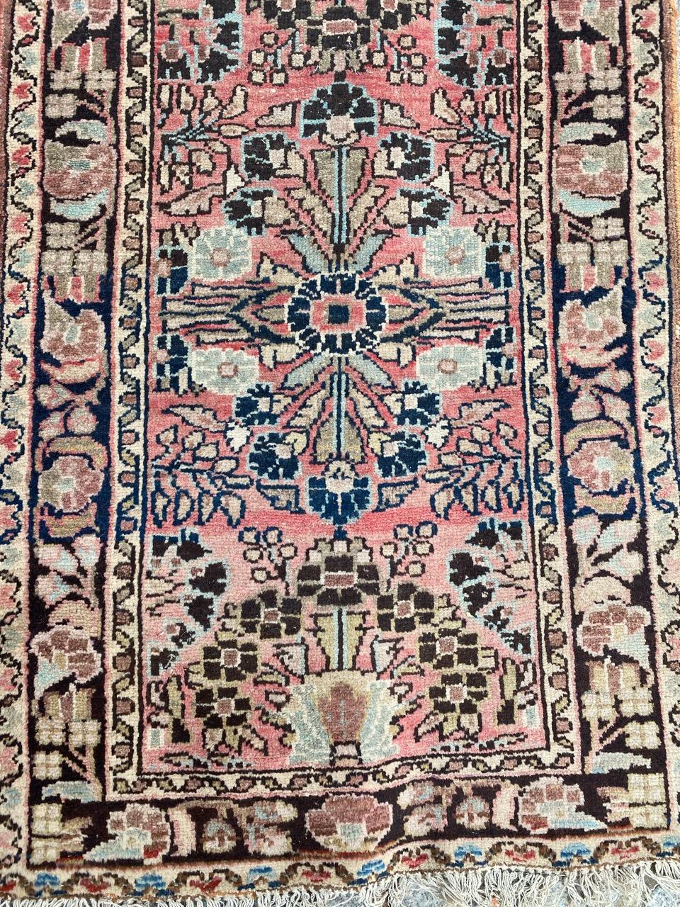 Beautiful early 20th century Hamadan runner with beautiful floral design and nice colors with a pink field color, entirely hand knotted with wool velvet on cotton foundation.