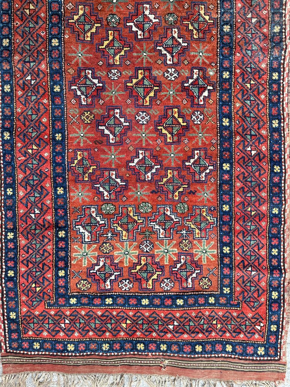 Very beautiful late 19th century tribal Kurdish rug, with nice geometrical and stylized designs and beautiful natural colours with a red orange field, red, green, yellow, blue and white at design, entirely hand knotted with wool on wool