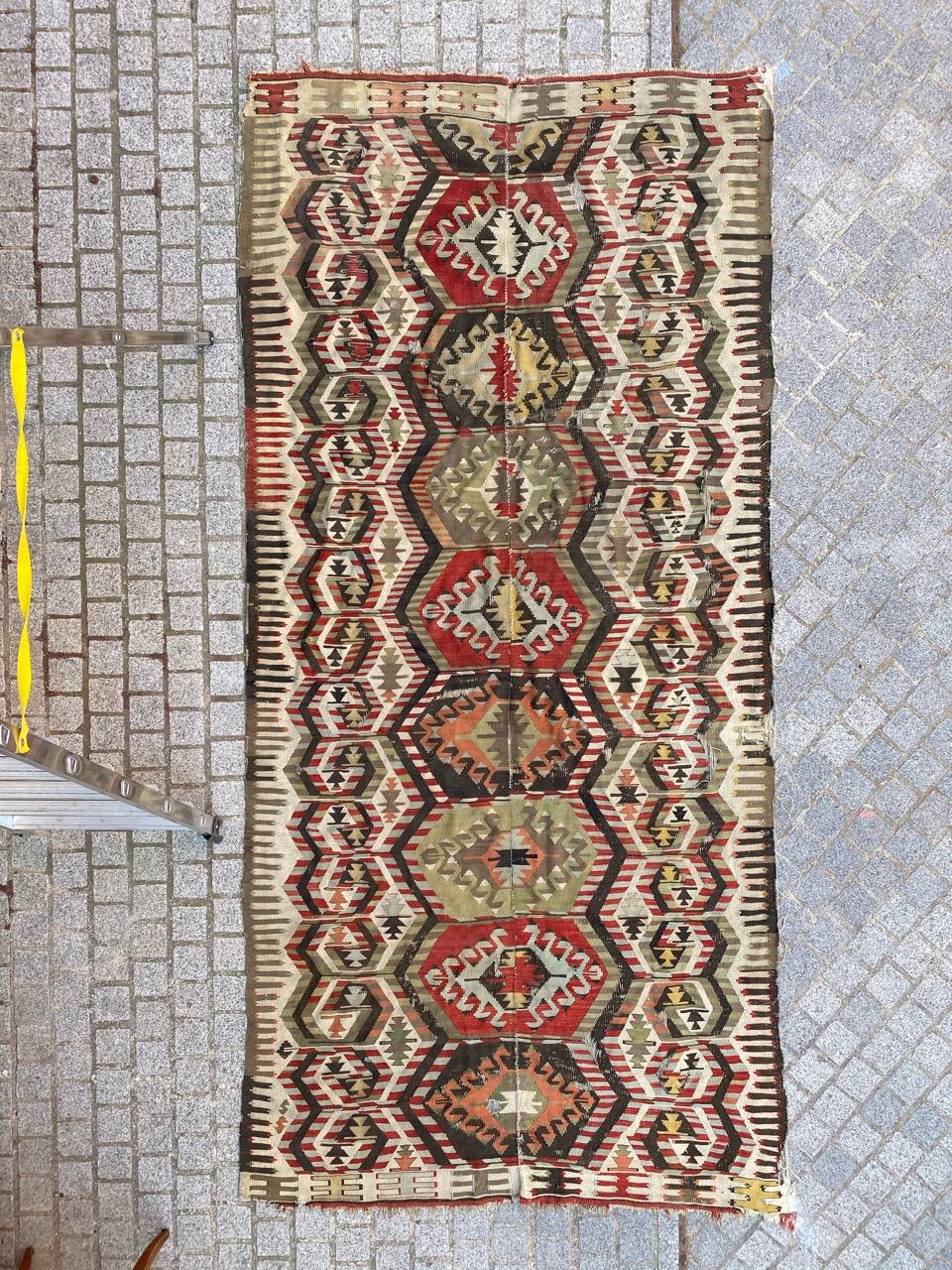 Very beautiful early 20th century Turkish Anatolian Kilim with a beautiful geometrical design and nice colors with dark brown, red, blue, yellow, green, orange and grey, entirely handwoven with wool on wool. Size: 5ft 2.21 inch x 10ft 5.99 inch.