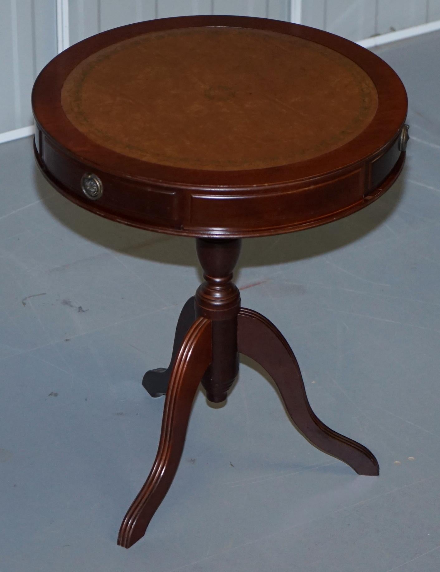 We are delighted to offer for sale this lovely Bevan Funnell mahogany with brown leather gold leaf tooled top, regency style side drum table

A very good looking and well made piece, the leather top is gold leaf embossed, the table has three nice