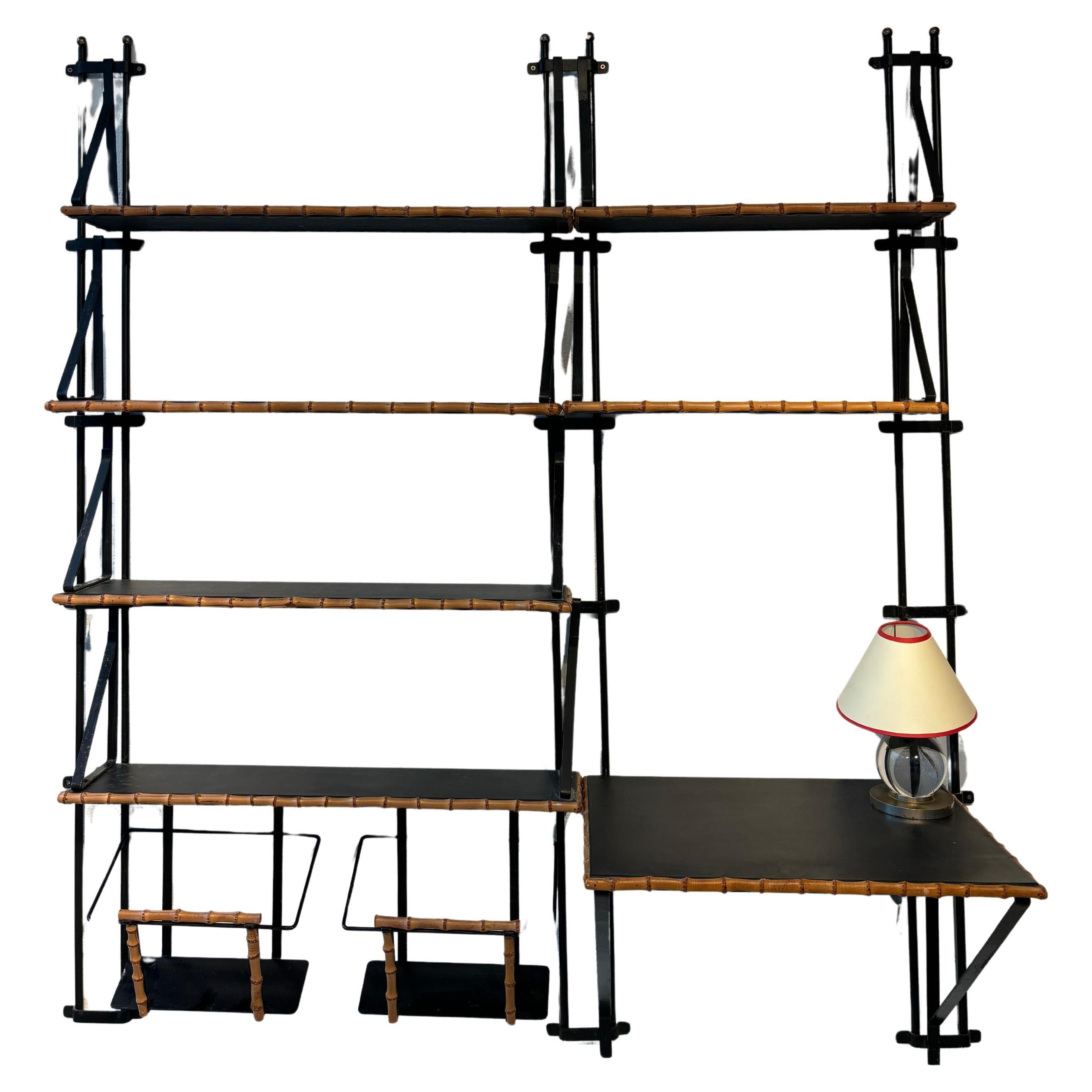 Nice bookcase by Jacques Adnet in vendita