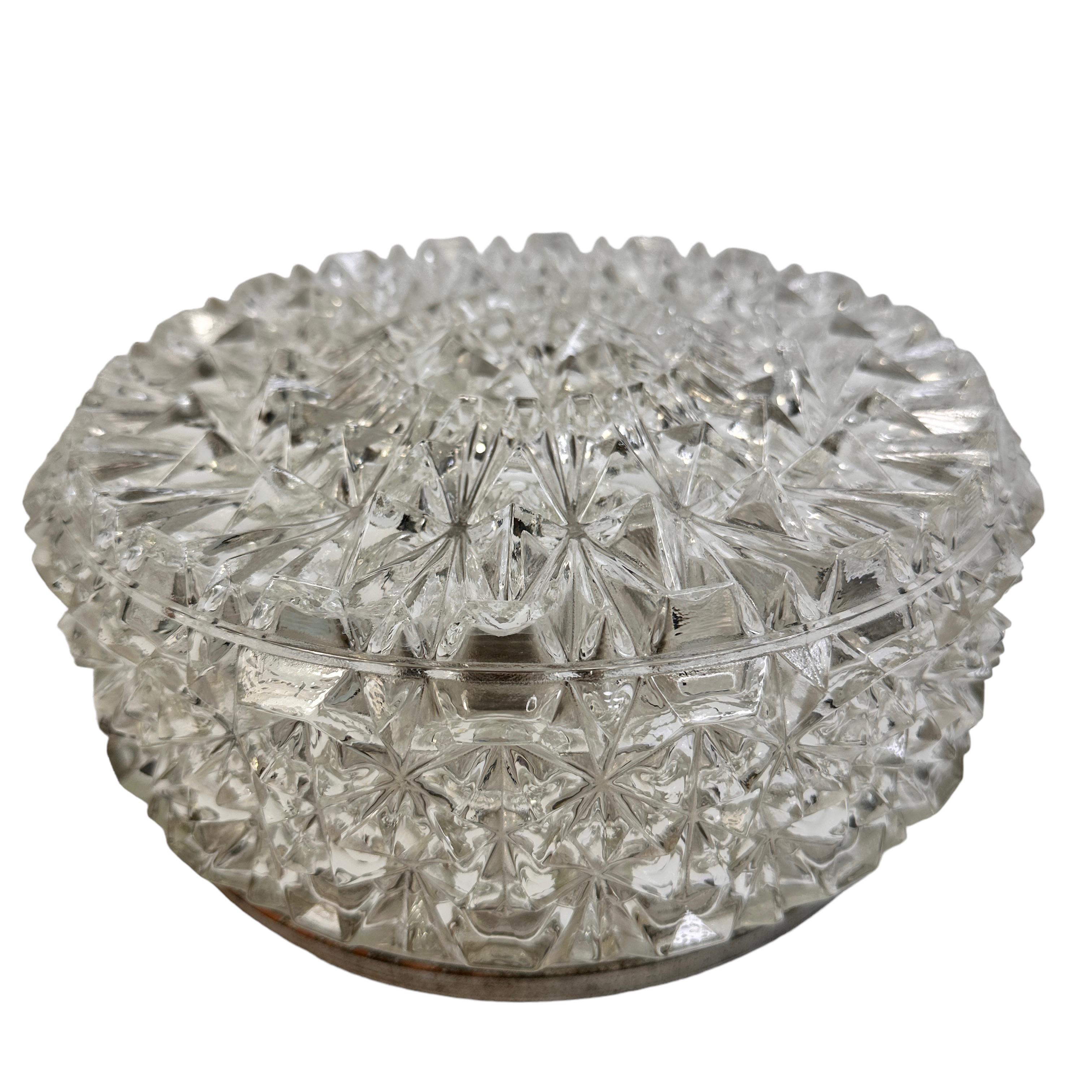 Beautiful ice crystal shape flush mount. Made in Germany in the 1960s. Gorgeous textured glass flush mount with metal fixture. The glass has a very cute design. The fixture requires one European E27 / 110 Volt Edison bulb, up to 100 watts. Found at