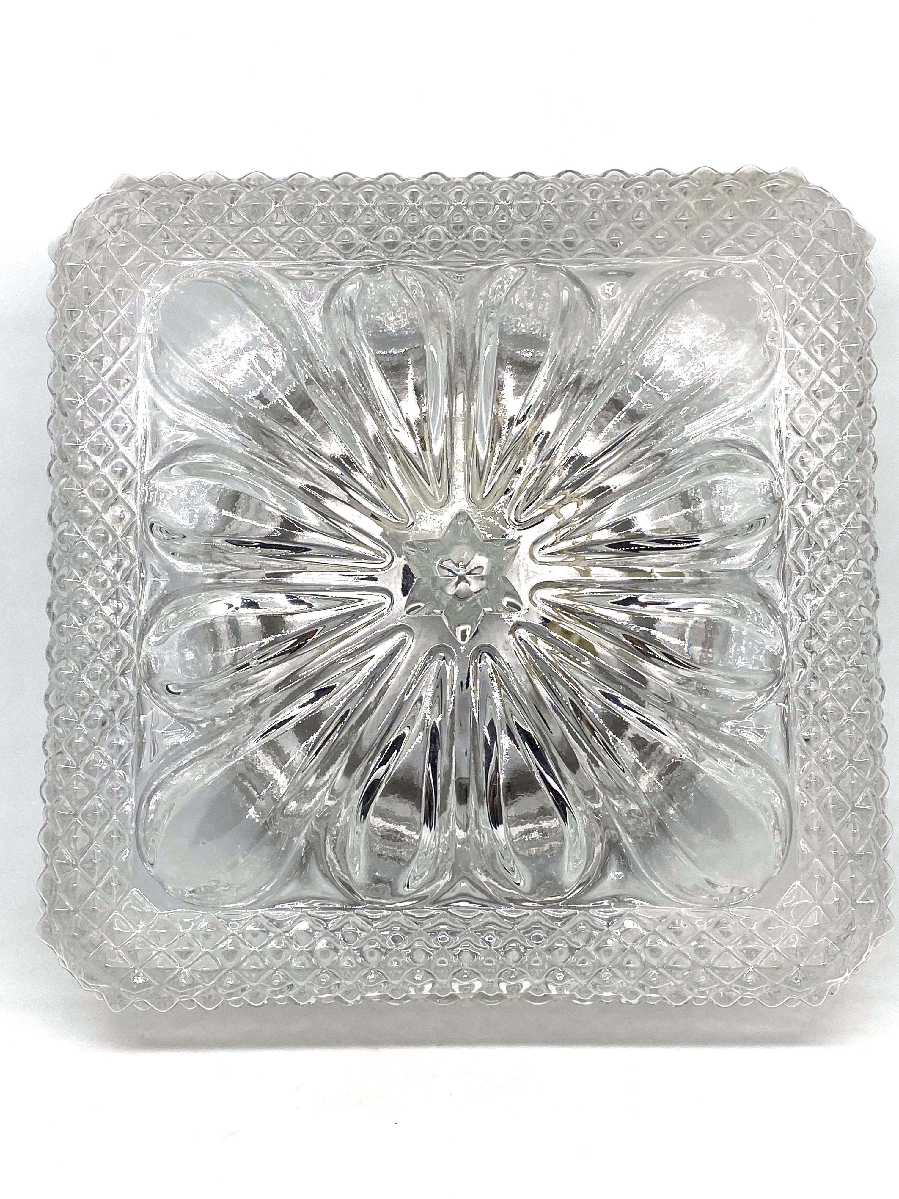 Beautiful flower shape flushmount. Made in Germany in the 1960s. Gorgeous textured glass flushmount with metal fixture. The glass has a very cute design. The fixture requires one European E27 / 110 Volt Edison bulb, up to 75 watts.