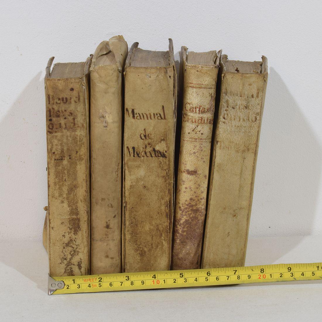 Nice collection of five extremely weathered vellum books, Spain 18th/ 19th century. Weathered ,small losses and old repairs. More photo's available on request.
H:20-21cm  W:2,5-4,5cm D:15,5cm 