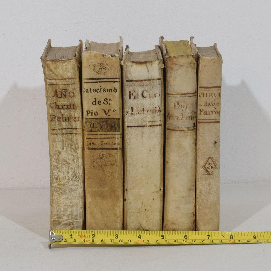 Nice collection of five extremely weathered vellum books, Spain 18th/ 19th century. Weathered, small losses and old repairs.
H:20,5-21,5cm  W:2,5-4cm D:15,5cm 