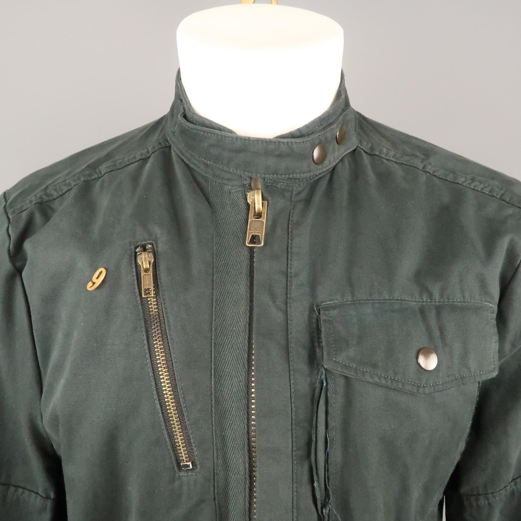 NICE COLLECTIVE jacket comes in a black cotton featuring multiple pocket details throughout, zipper and snap closure, a tab collar, and a front gold toned 
