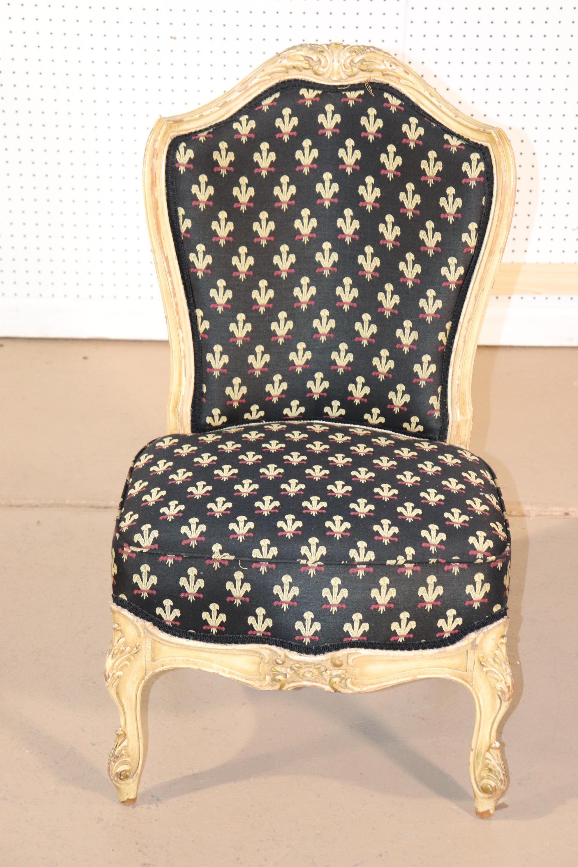 This is a beautiful antique chair that dates to the 1900s era and is painted in a beautifully distressed chair. The chair measures 34 tall x 20 wide x 18 deep and the seat height is 15 inches in seat height.
