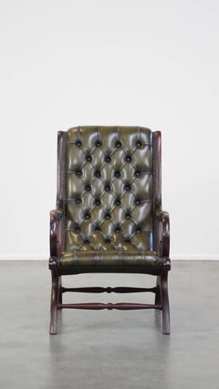 Nice, elegant green cowhide leather chesterfield armchair combined with wood