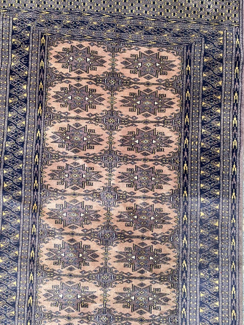 Beautiful long rug from Pakistan with a Turkmen design and beautiful colors, entirely and finely hand knotted with wool velvet on cotton foundation.