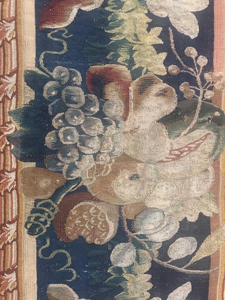 Beautiful late 17th century fragment of a tapestry Flandre Bruxelles, with beautiful design and green colors, composed by a fragment of border, wool and silk woven on wool foundation.