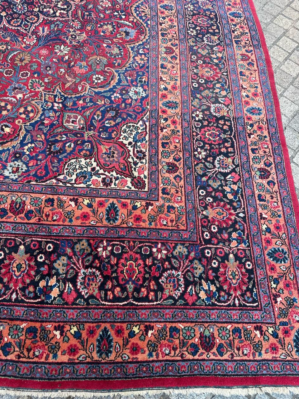 A stunning early 20th-century Dorokhsh rug, boasting a large size and exquisite features. This masterpiece showcases a captivating floral design with a rich array of natural colors. Meticulously hand-knotted using wool velvet on a cotton foundation,