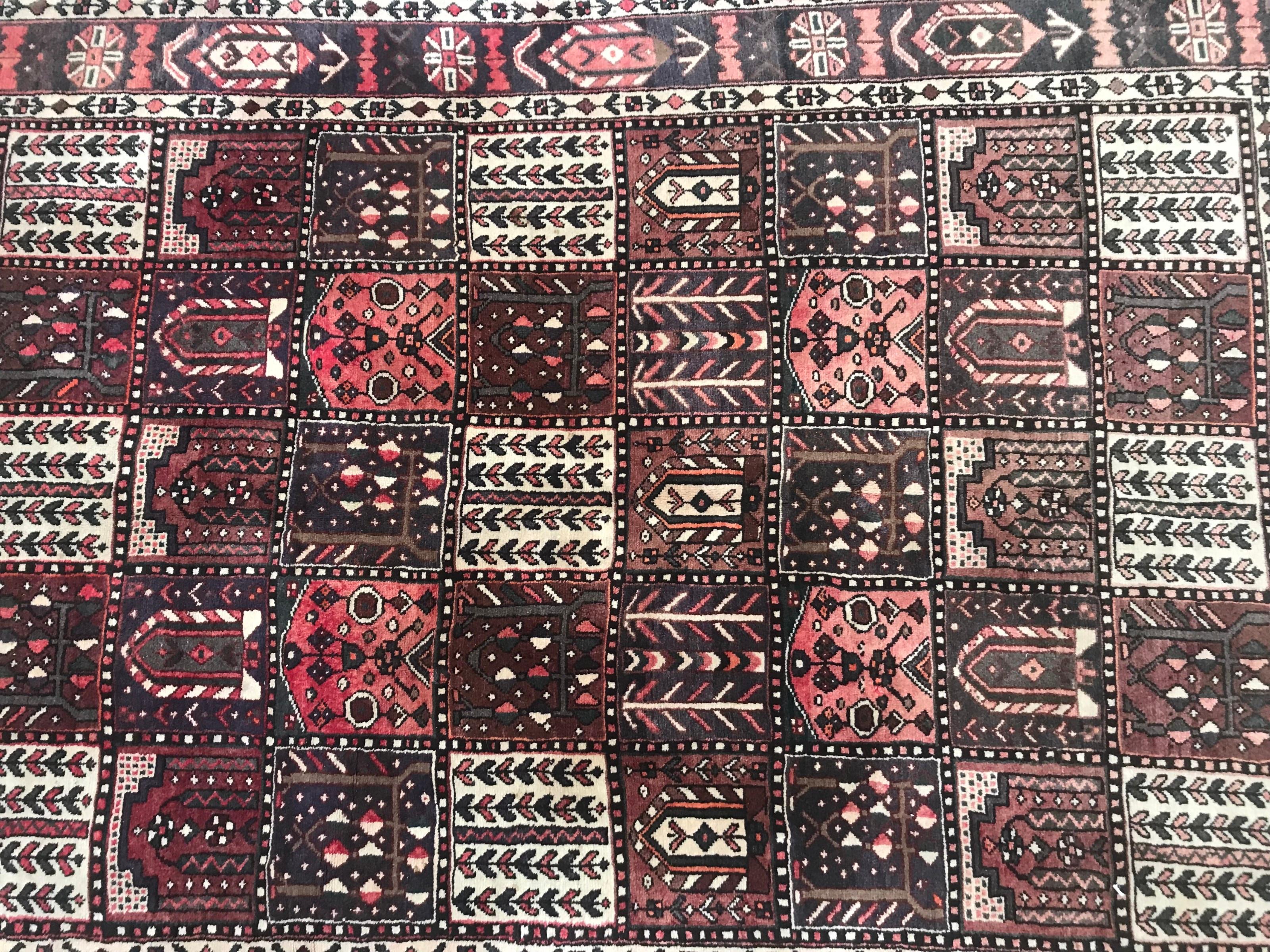 Beautiful mid-20th century rug with a beautiful design with checkerboards, nice colors with blue and red, entirely hand knotted with wool on cotton foundation.