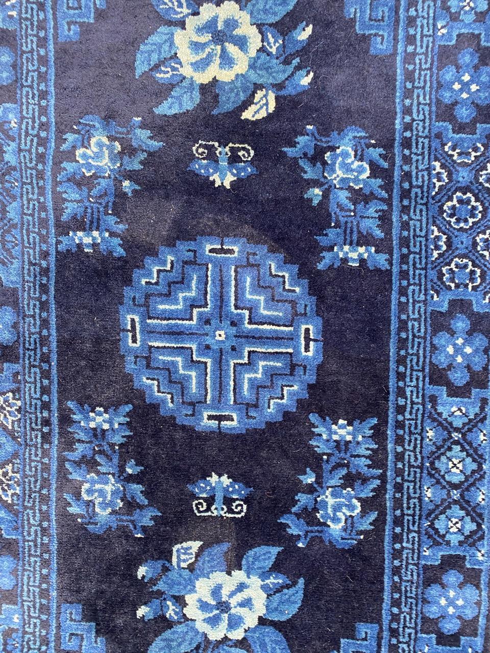 Beautiful late 19th century Chinese rug with beautiful Chinese design and blue field color, entirely hand knotted with wool velvet on cotton foundation.