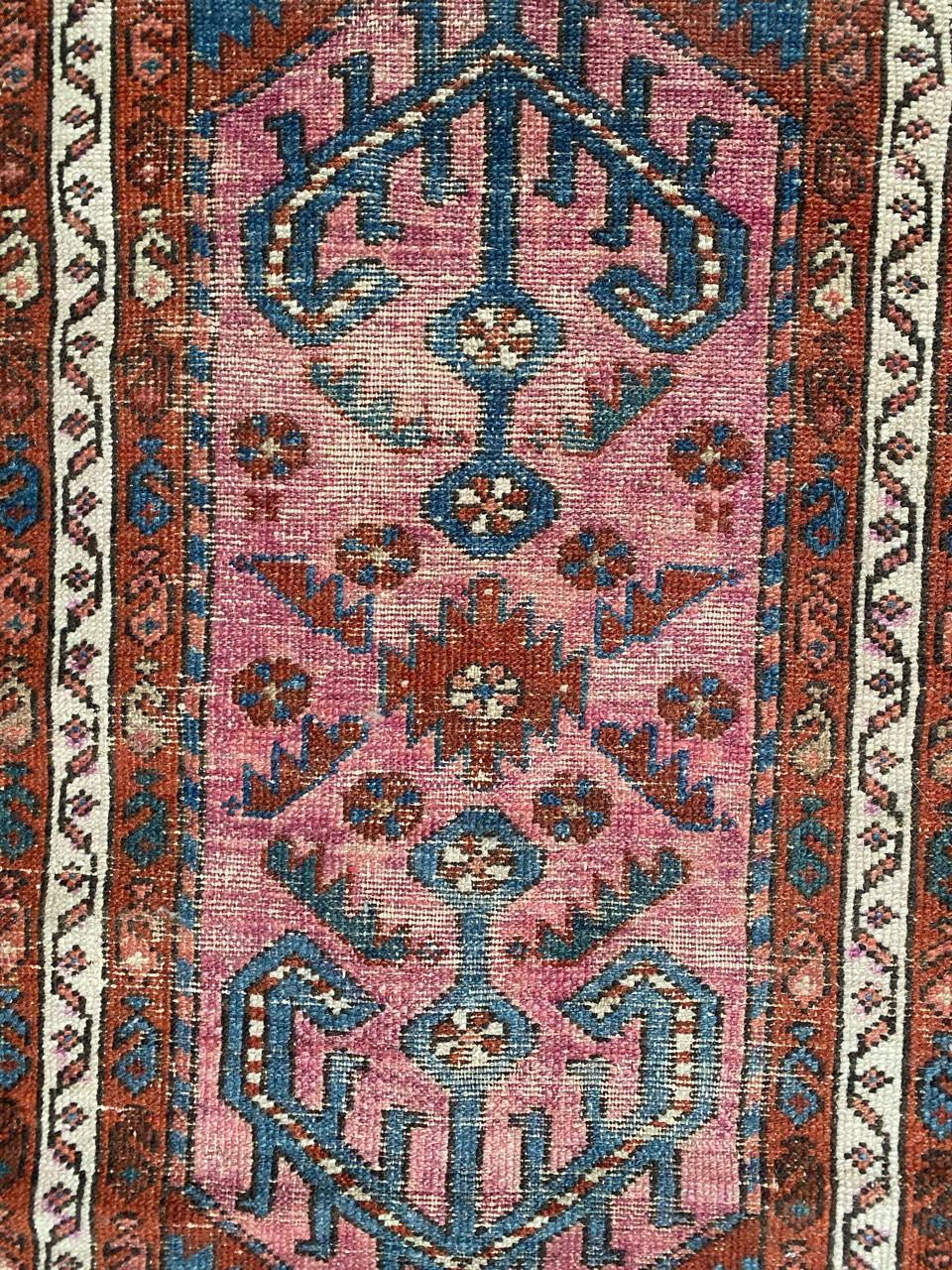 Very beautiful late 19th century little rug with a tribal design and nice colors with red, purple and blue, entirely hand knotted with wool velvet on cotton foundation.