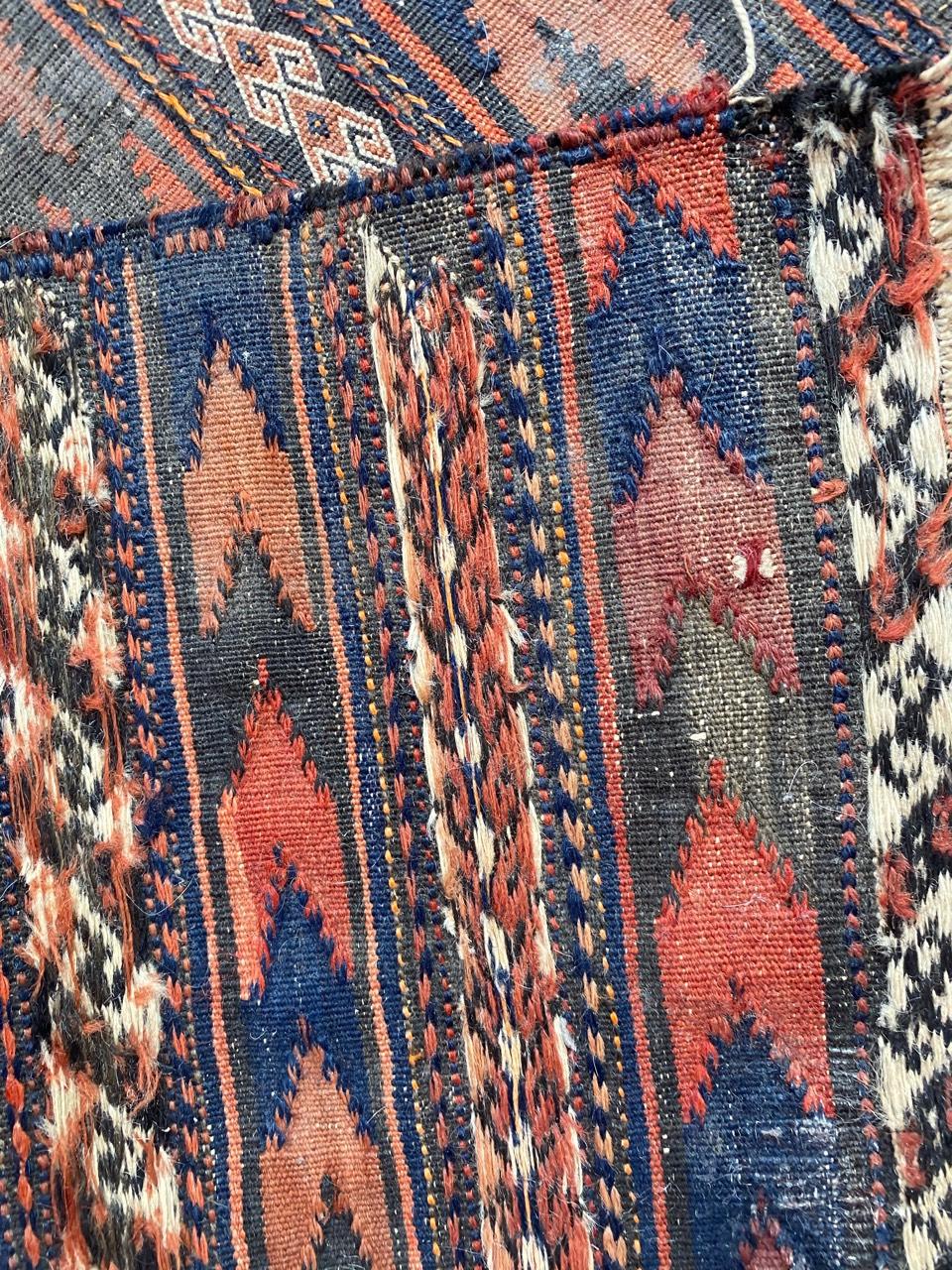 Beautiful midcentury Kilim with a tribal design and nice colors with red, blue, orange and brown, entirely handwoven with wool on wool.