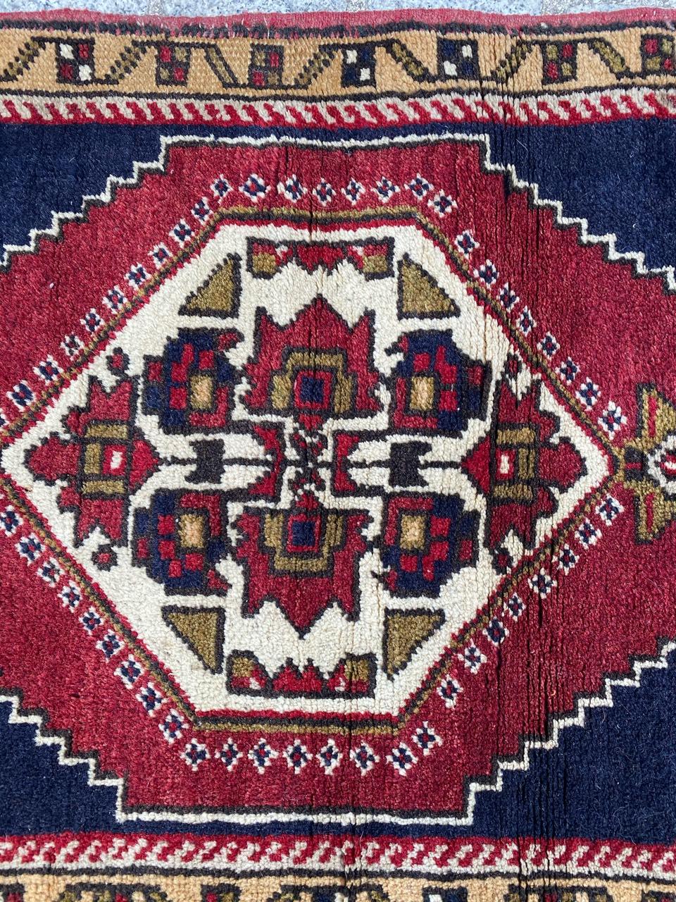 Beautiful Turkish rug with a geometrical design and nice colors with red, blue, yellow and green, entirely hand knotted with wool velvet on wool foundation.