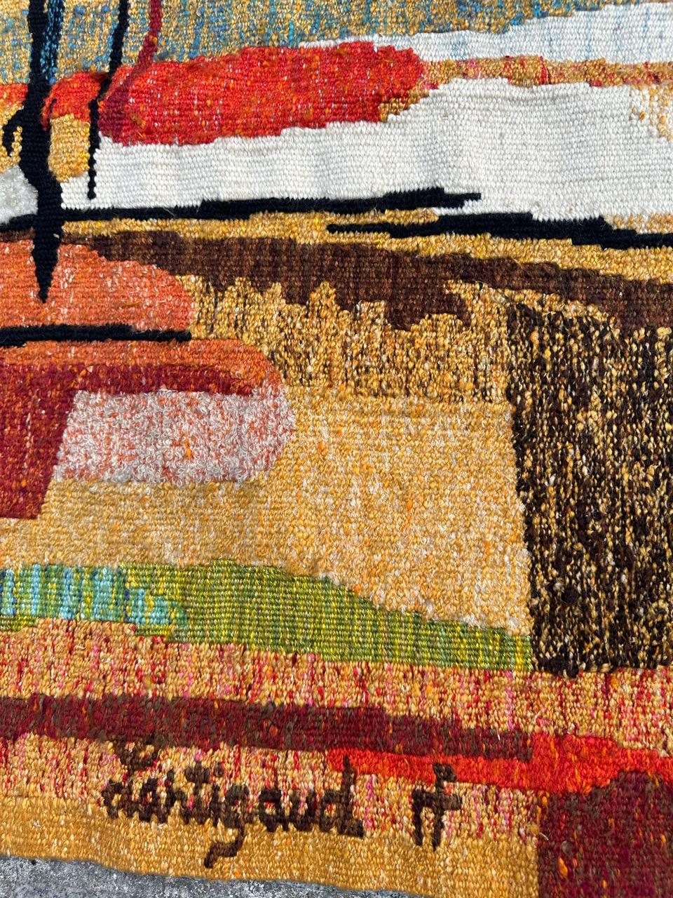 Discover the elegance of modern French tapestry with the exquisite design by Jean Michel Lartigaud. This limited edition masterpiece, woven in vibrant shades of orange, yellow, red, blue, green, brown and white, adds a touch of sophistication to any