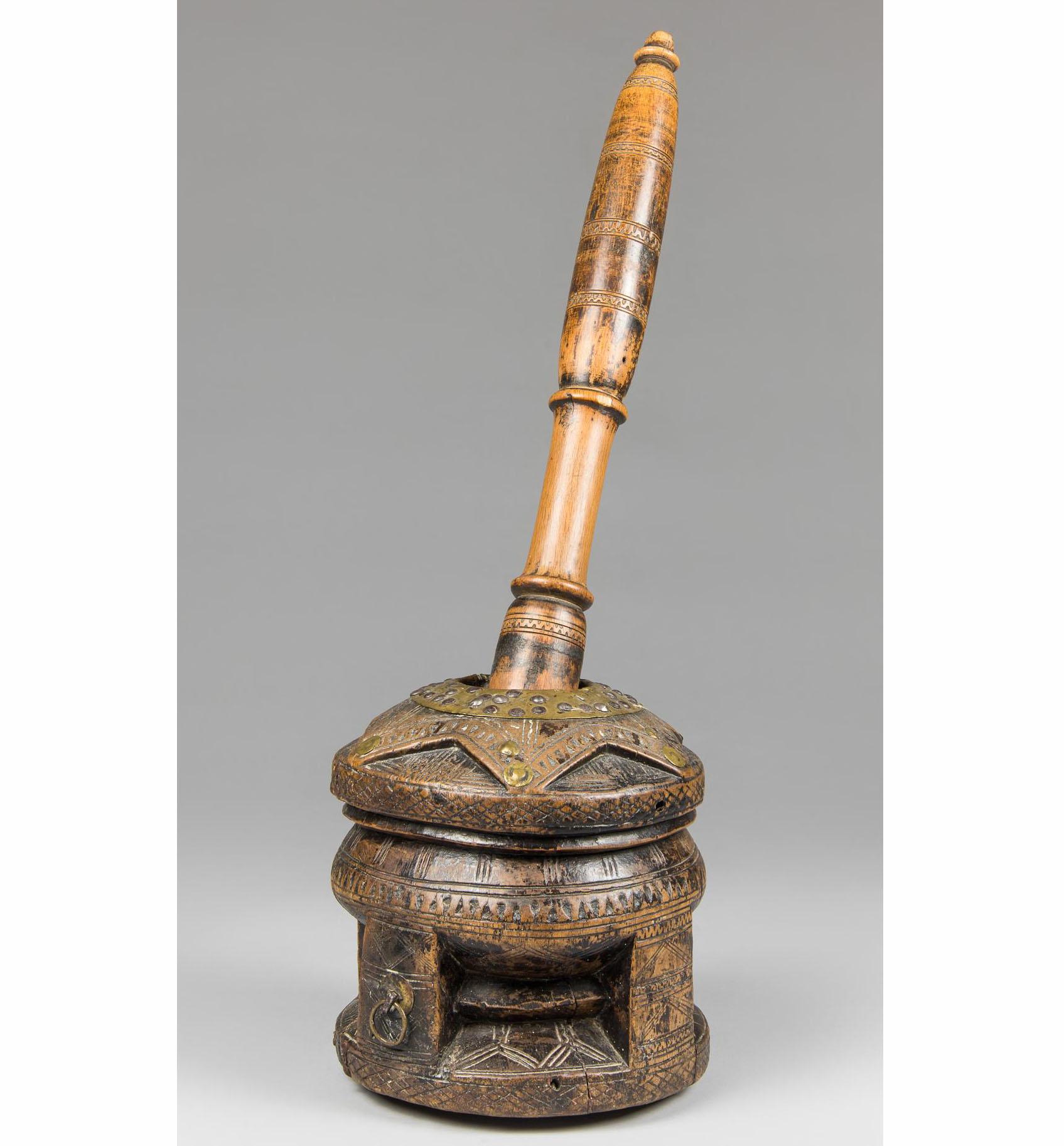 Old carved wood Coffee Mortar Somalia Bedouin

Heavy hard wood with carved detail and metal attachments complete with carved pestle 

condition old cracks repaired on mortar but fine

Period early 20th century

Nice decorative antique item

 
 
 