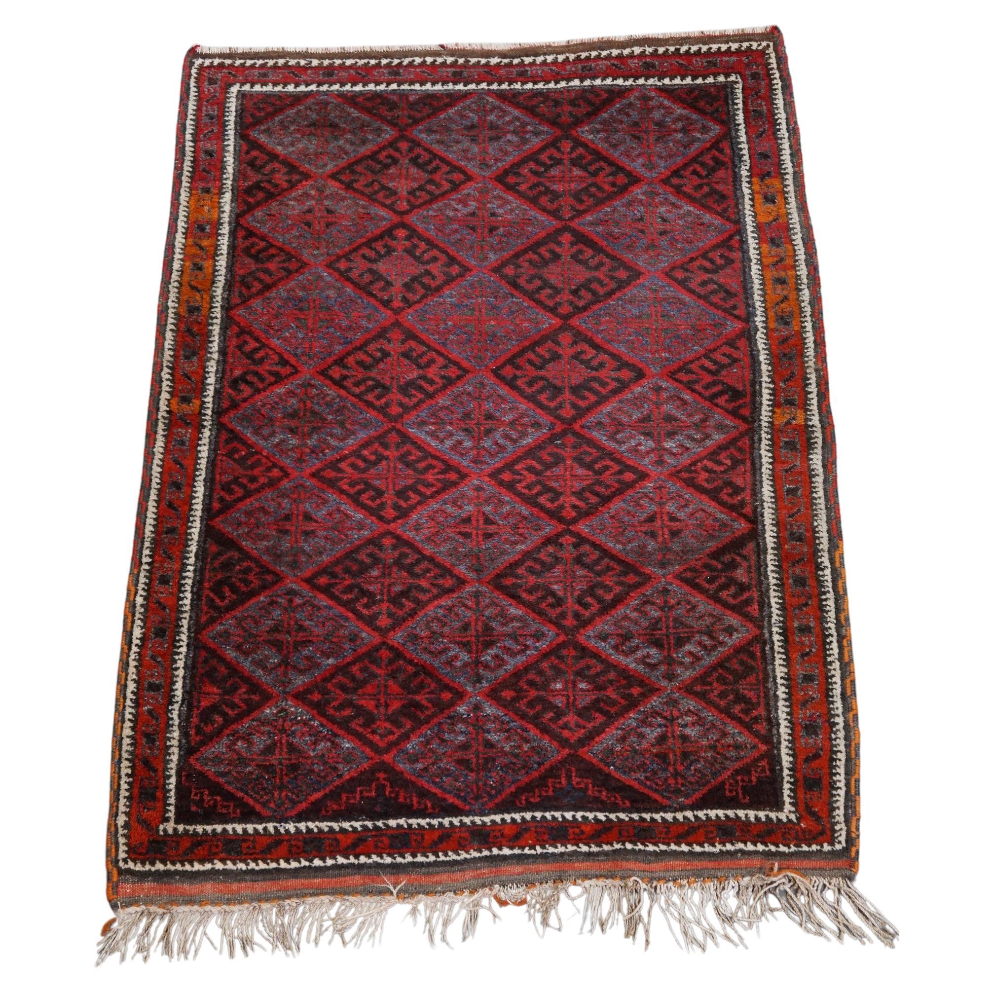 Nice oriental rug in mainly red and gray tones and a beautiful motif 150x100cm