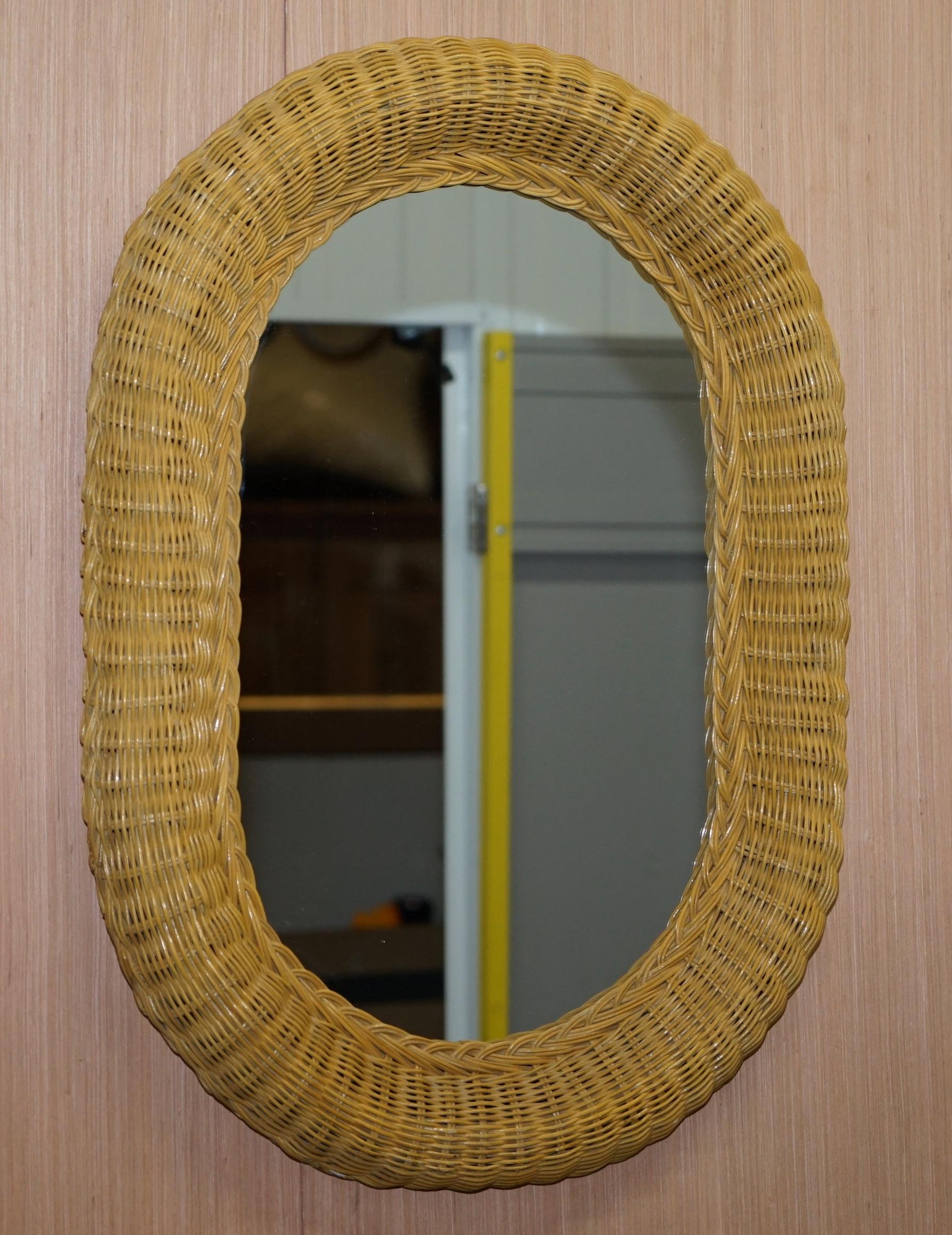 We are delighted to offer for sale this very nice oval wall mirror with rattan frame

A very good looking and decorative mirror in perfect condition, it can of course be hung horizontally and vertically 

Dimensions:

Height 72cm

Width