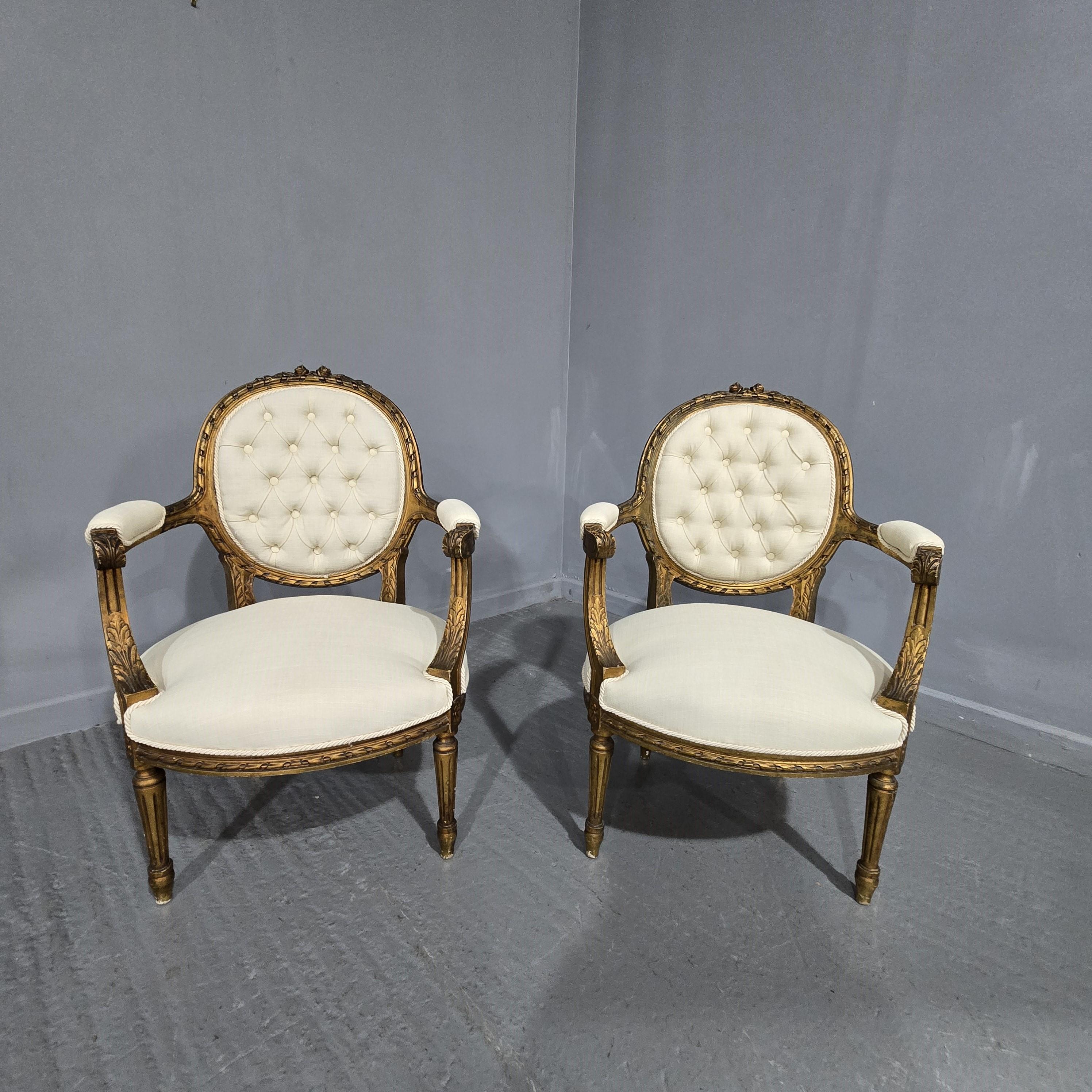 A very good pair of French gilt deep buttoned elbow chairs, recently upholstered in cream linen, very good overall condition.

37