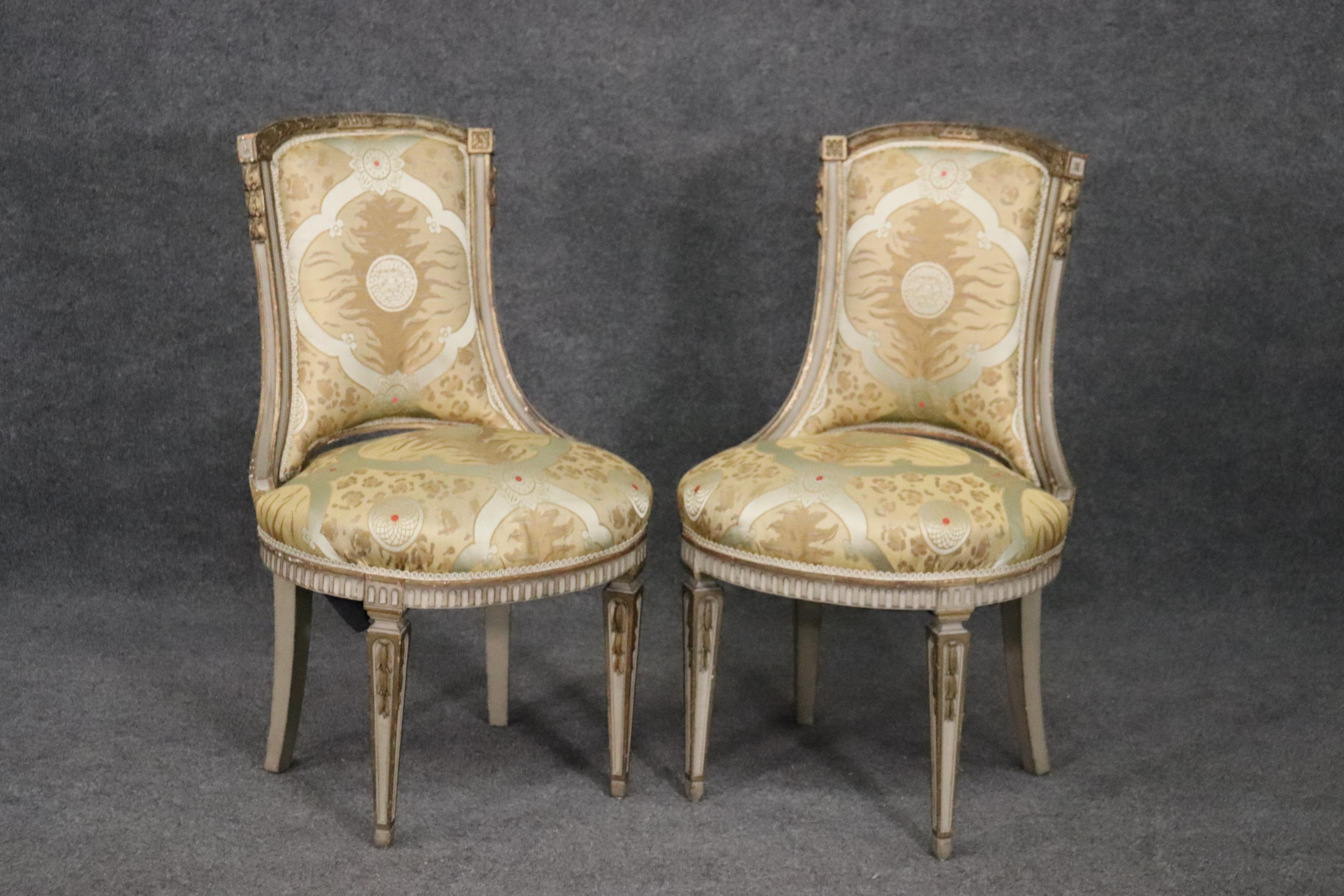 Beautiful pair of chairs. Nice painted frames. The upholstery is original so it may need to be redone. Measures 36 tall x 20 wide x 21 deep x seat height of 19.