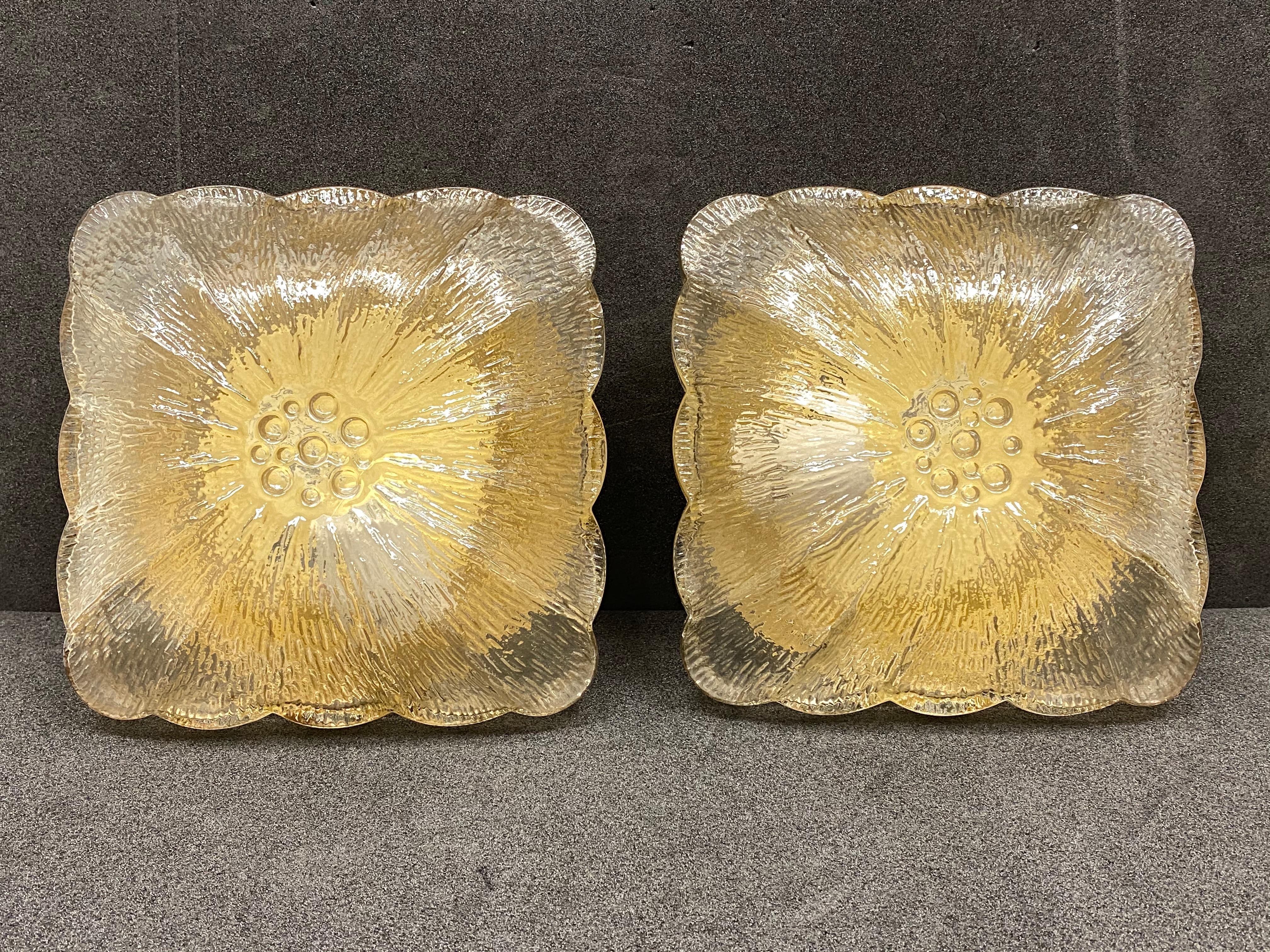 Pair of beautiful flower shape flush mount. Made in Germany in the 1960s. Gorgeous textured glass flush mount with metal fixture. The glass has a very cute design. Each fixture requires one European E27 / 110 Volt Edison bulb, up to 60 watts.
